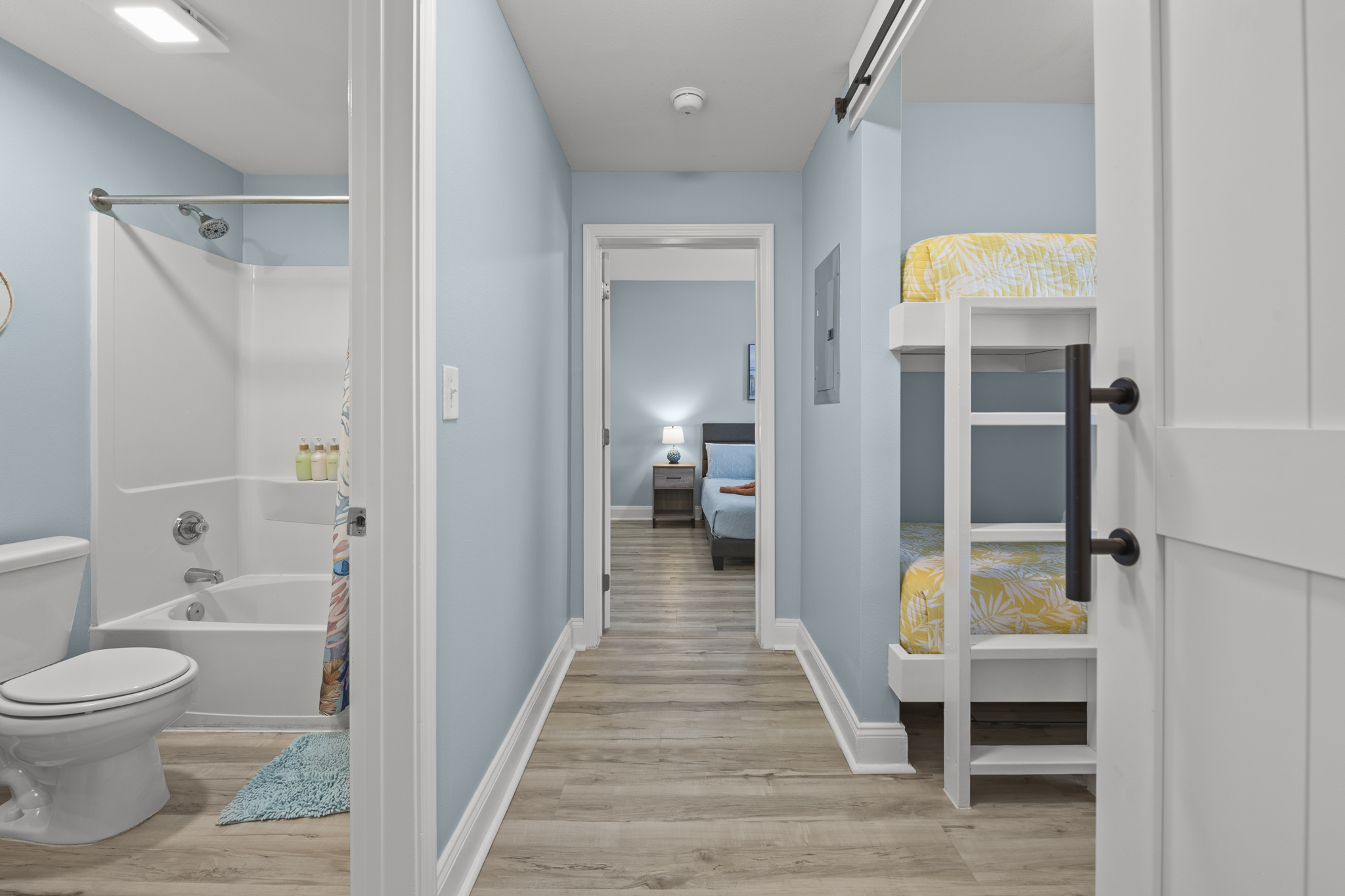 Bunk room on the right, 2nd bath on the left and 2nd King bed at end of hall.  Both bedrooms have lake view