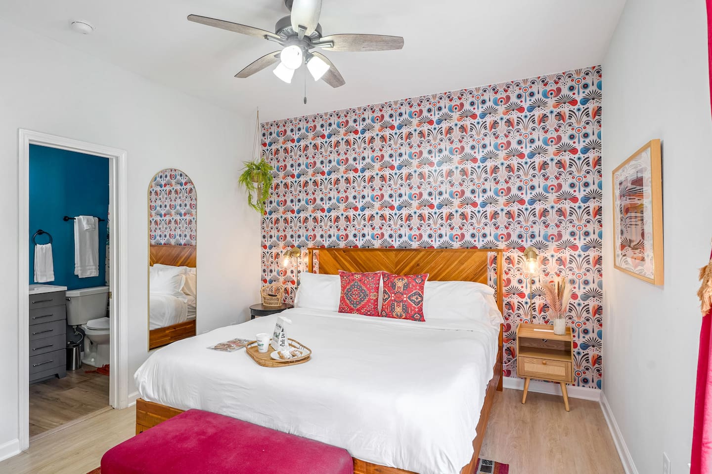 Relax in the downstairs master featuring a premium king bed, smart TV, and en suite bath