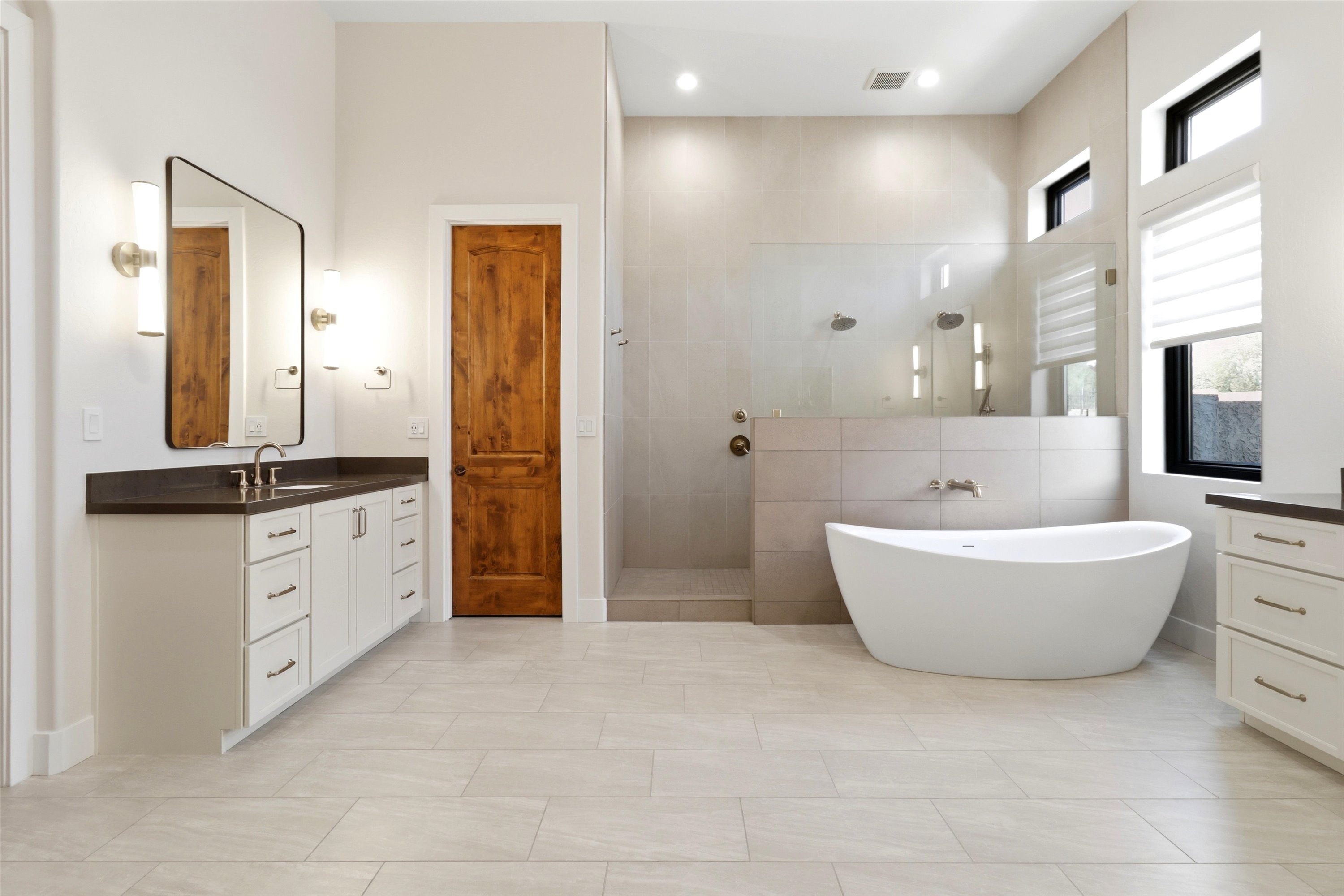 Bathroom with a soaking tub, walk-in shower, double vanity, and plenty of space to get ready.