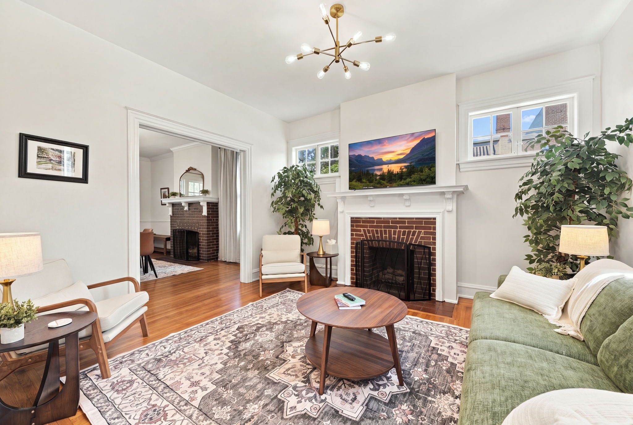 Living Room: Sunlit space with stylish decor, a warm fireplace, and mountain views await you!