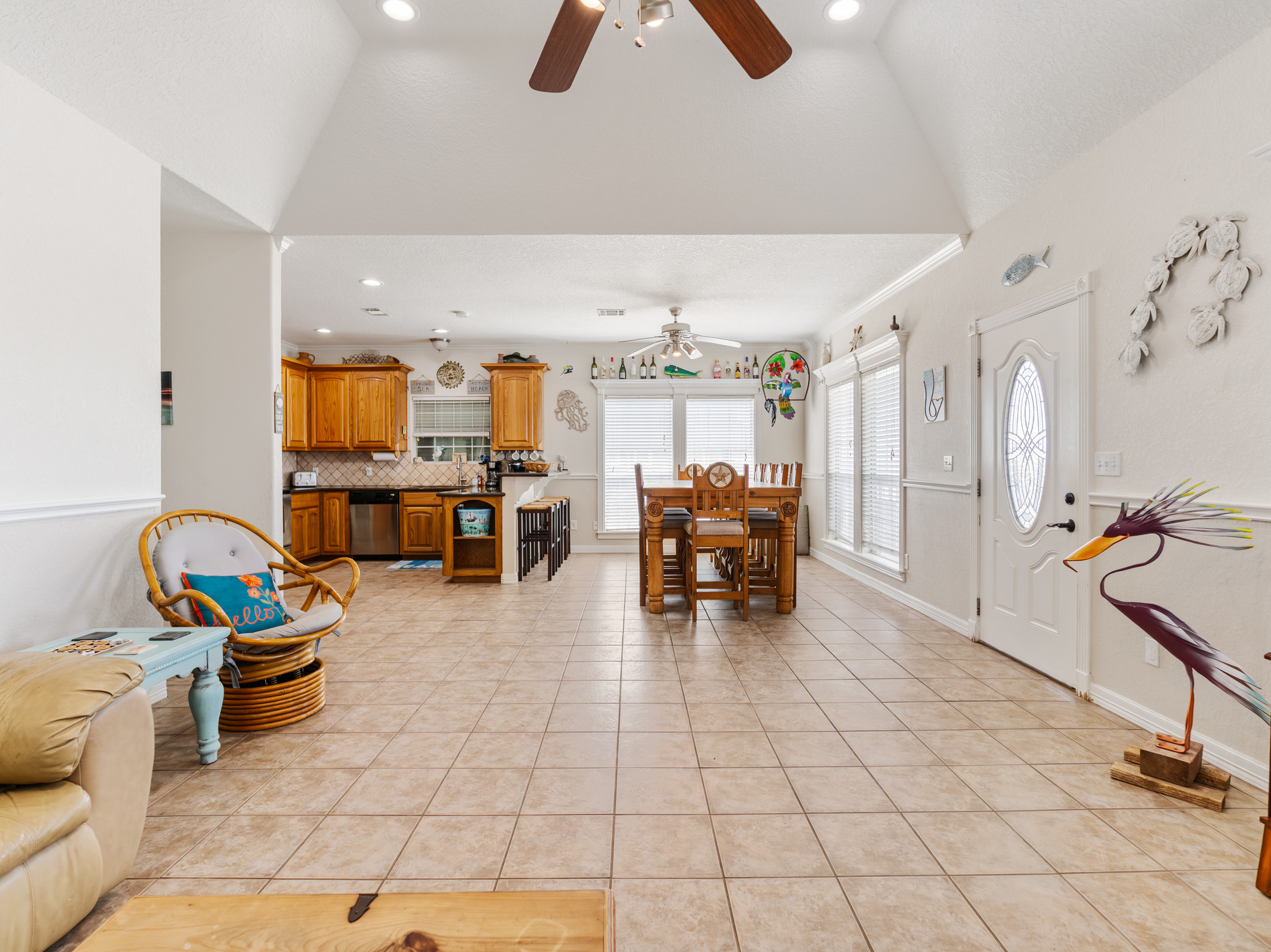 View of dining room and kitchen from living room. Dining room table seats 10