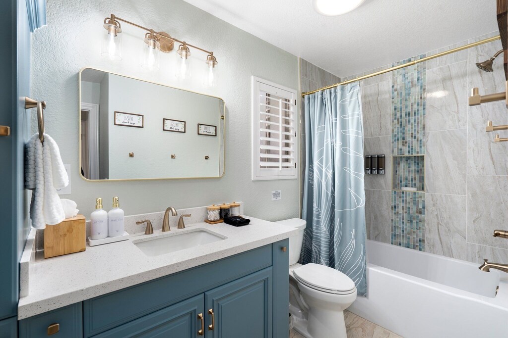 Renovated main bathroom with brushed gold finishes and much more.