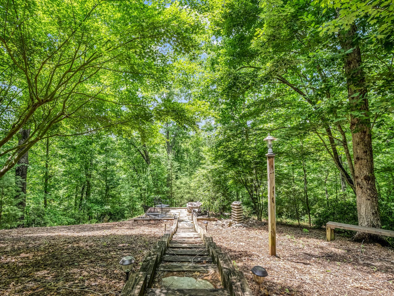 Follow the forest path to the fire pit and outdoor gathering space