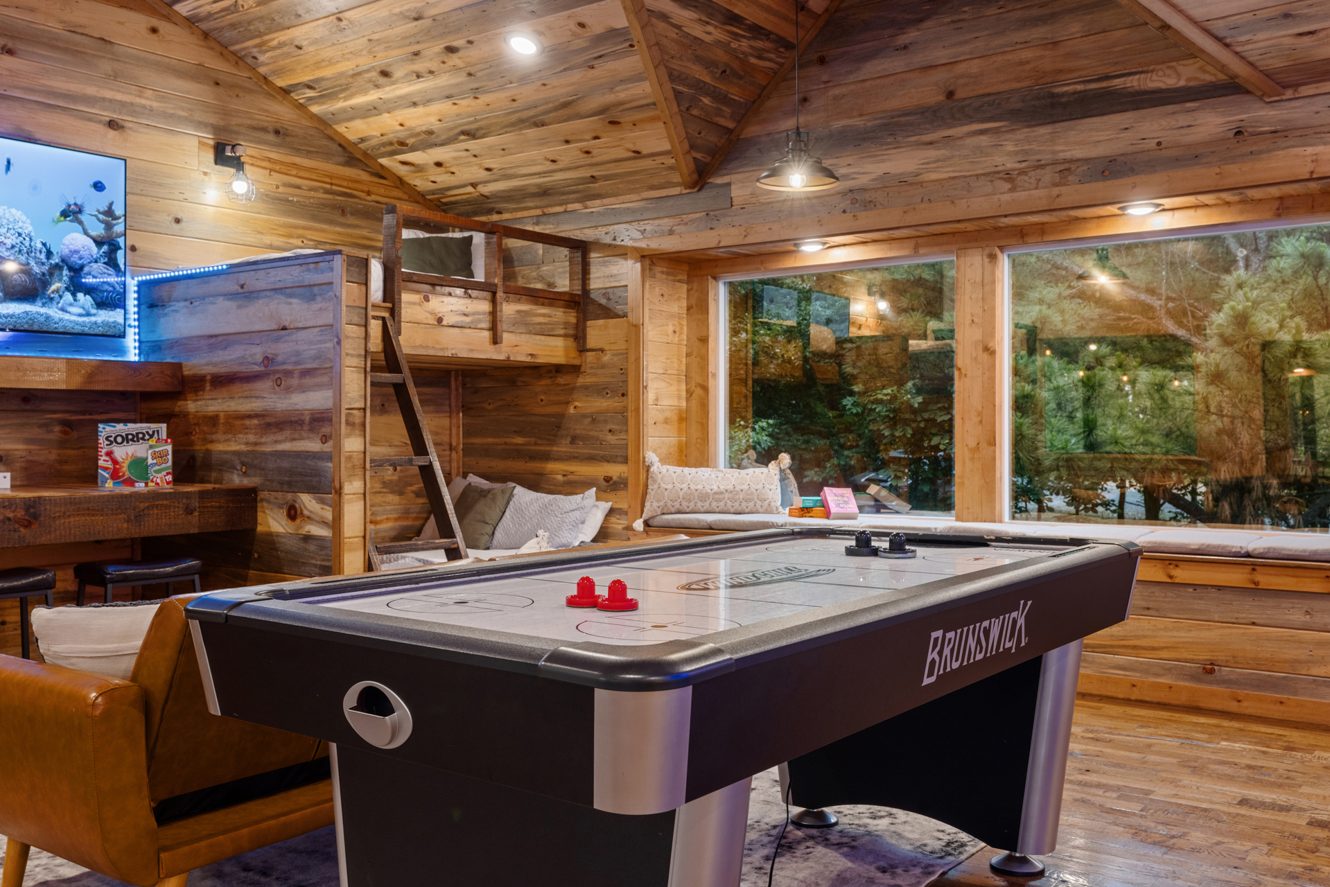Air hockey battles in the game loft tend to get loud in the best way possible. 
Fast hands, friendly rivalries, and nonstop rematches turning this upstairs hangout into everyone’s favorite part of the cabin.
