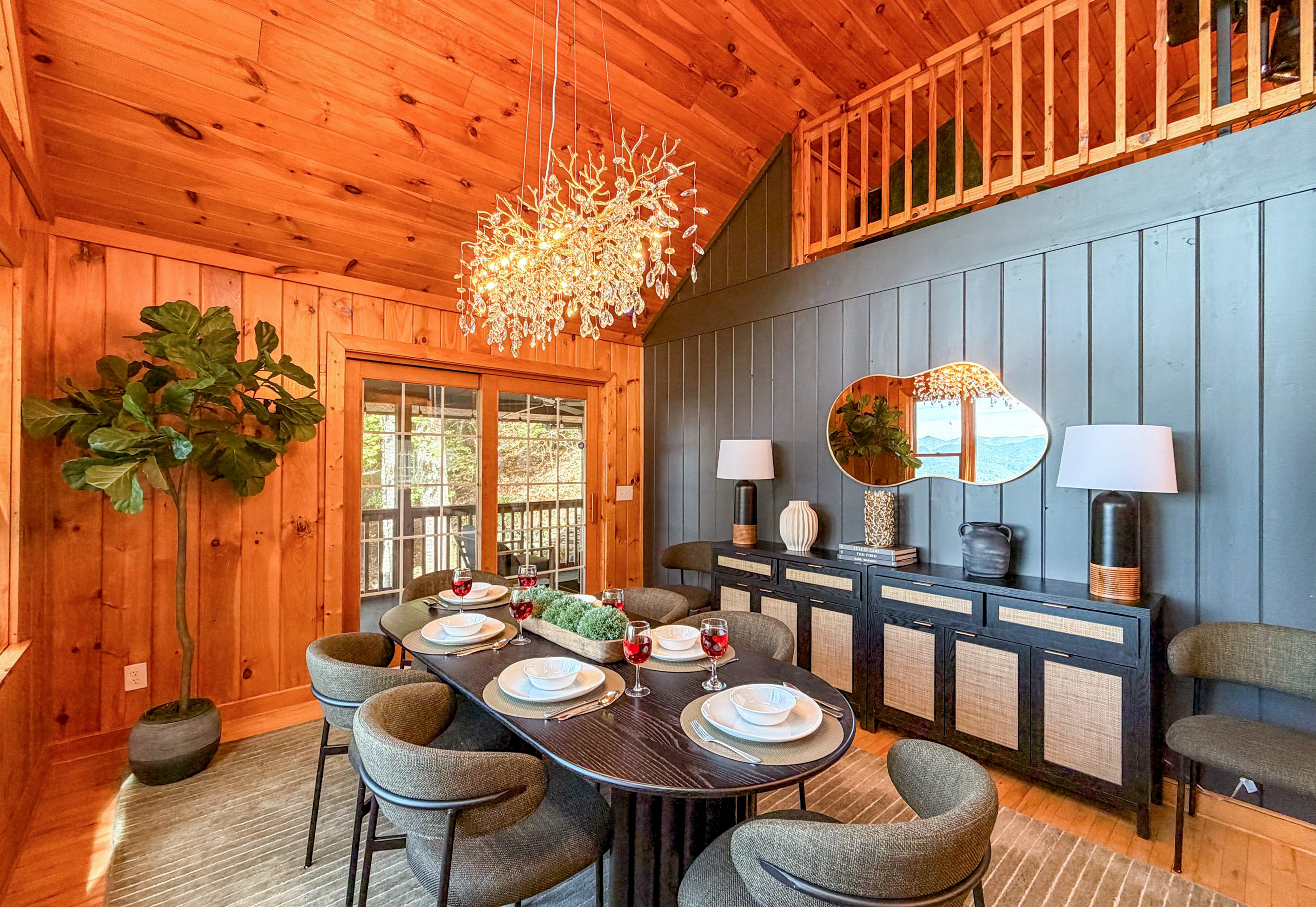 Our dining area features elegant rustic decor and comfortably seats up to six guests, perfect for enjoying meals with a view.