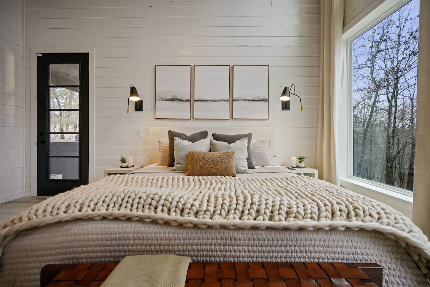 Soft drapes, lush pillows, and a blanket made for cuddling