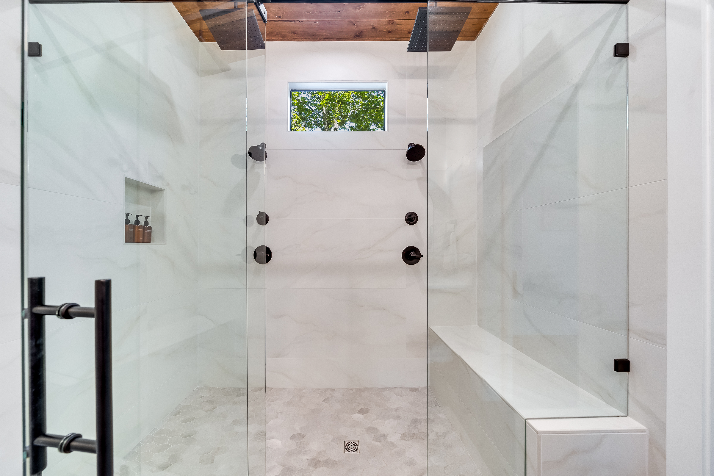 Ensuite Bathroom 3 - Attached to King Suite 3. Featuring enormous rain shower with quad showerheads, and spa-quality marble finishes. Includes premium toiletries (body wash, shampoo, conditioner, hand soap) and hotel quality towels. 