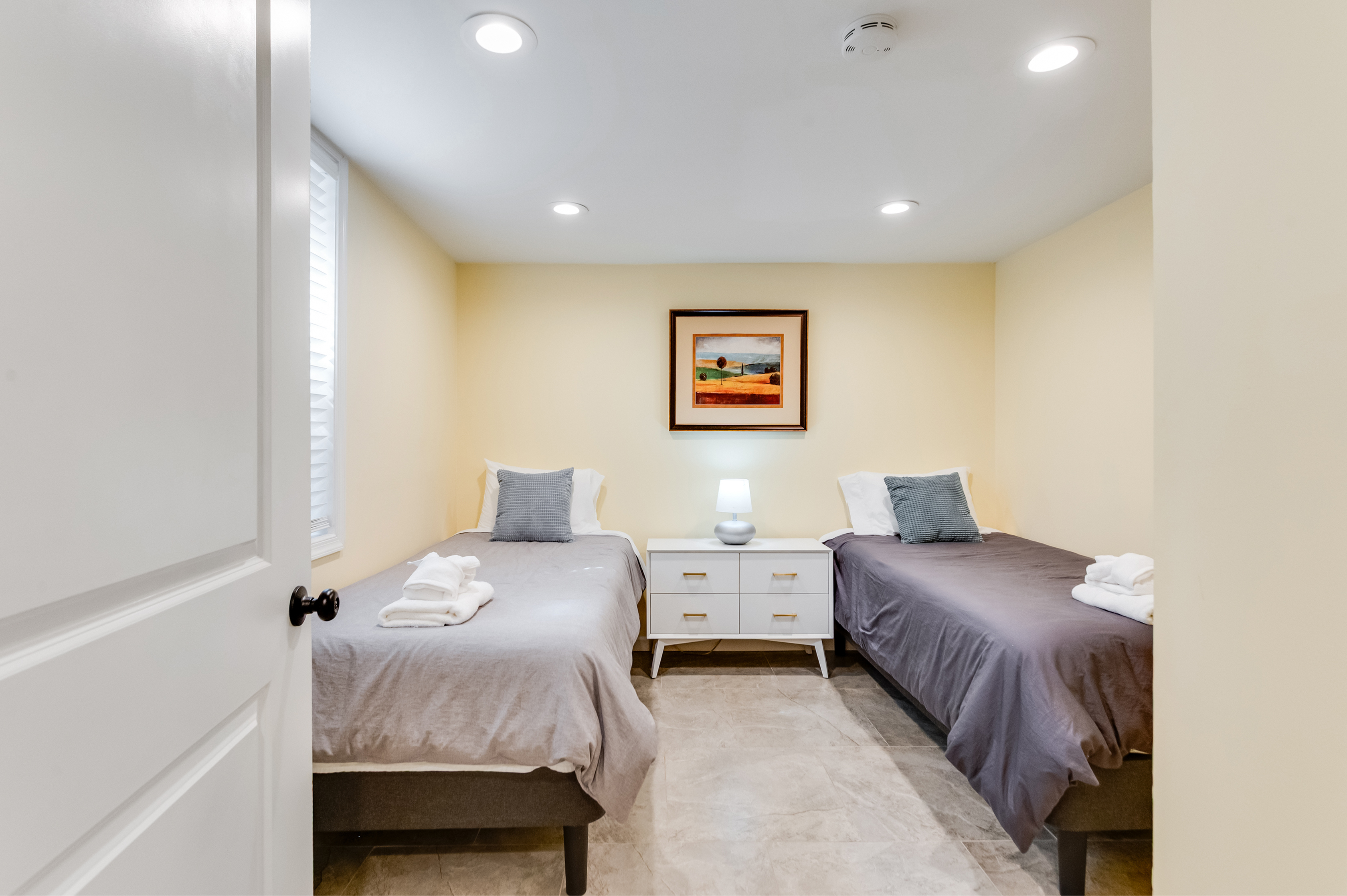Downstairs Twin Bedroom 4: Bright space with two beds, perfect for friends or family adventures in Quinton!