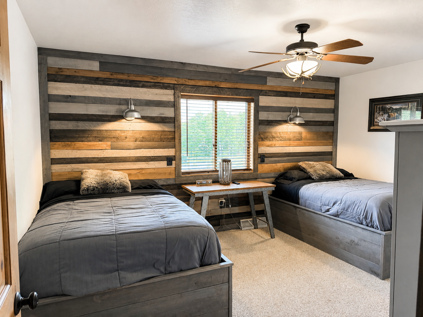 Comfortable multi bed bedroom with rustic wood accents and plenty of sleeping space, making the lodge a great option for families, trail groups, and larger Northwoods getaways.