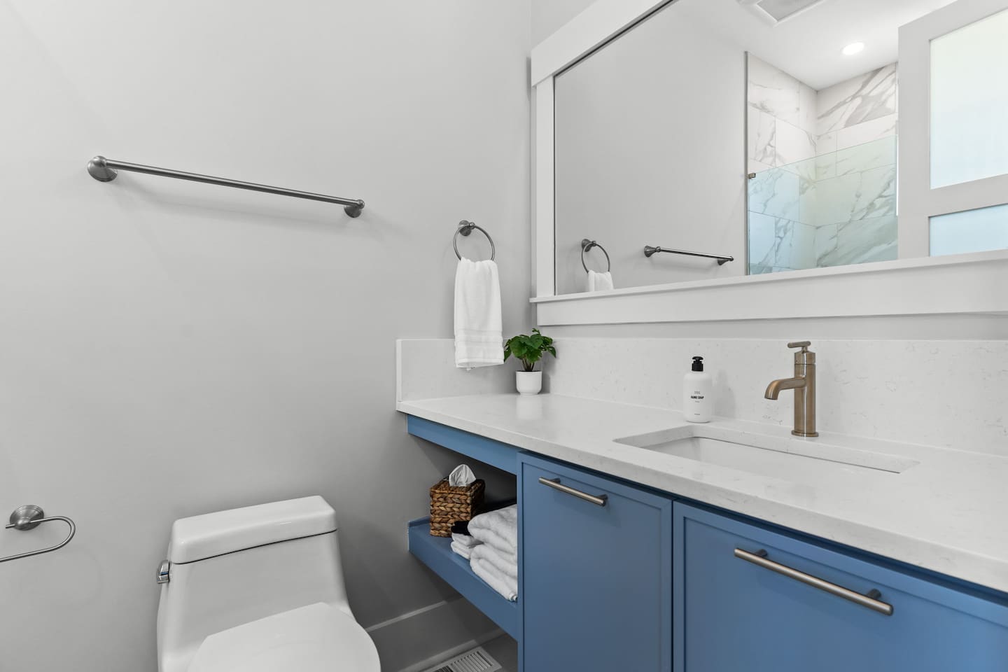 Thoughtful touches make every stay easier. This private en-suite bathroom comes stocked with essentials like hand soap, makeup cloths, tissues, and more.