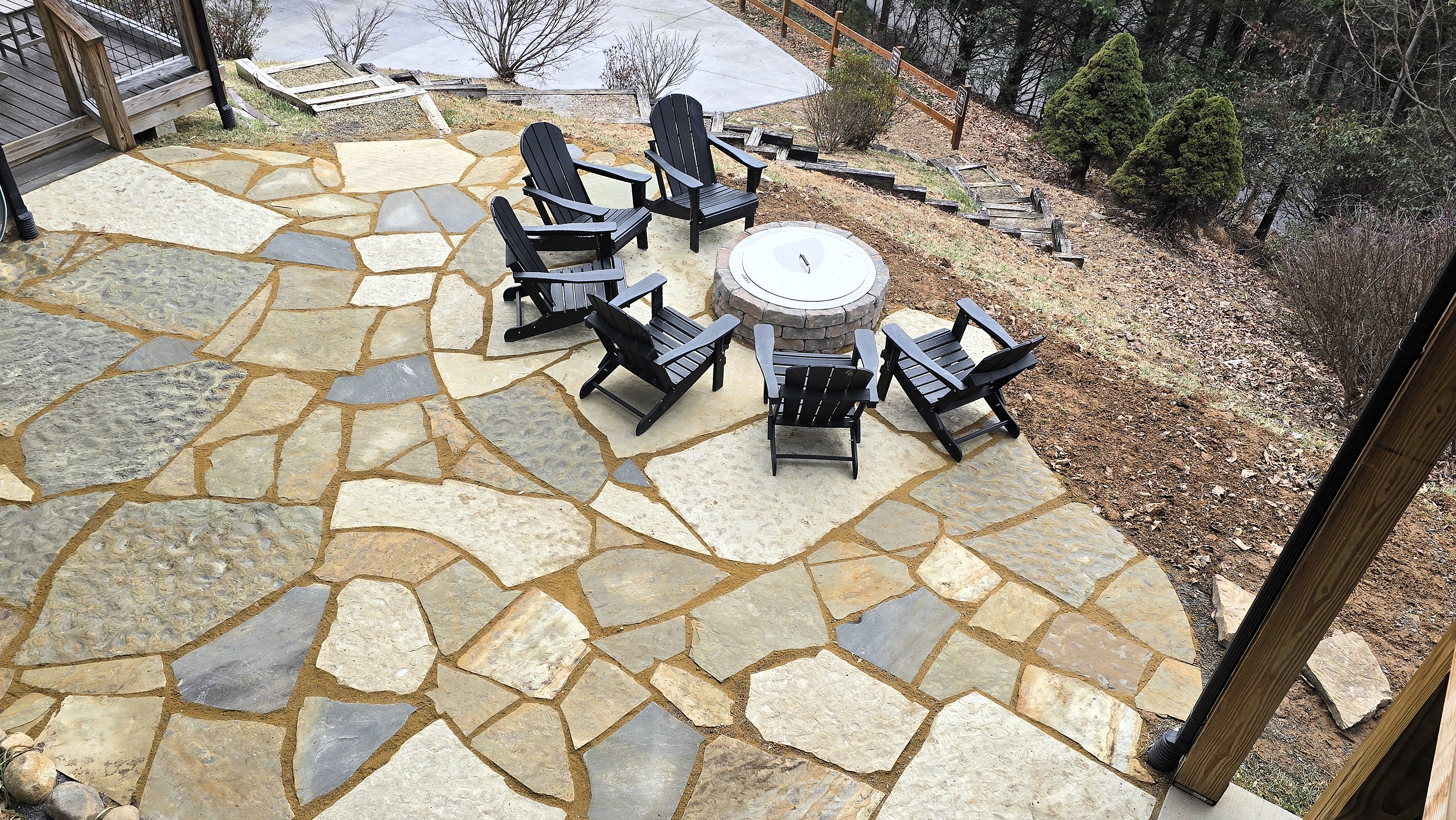 Firepit on the edge of a large, private courtyard