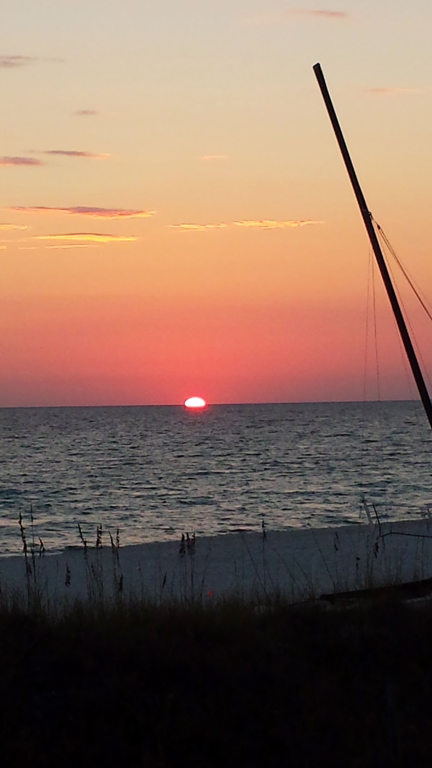 The sky turns the most brilliant shades of pink, orange, gold and purple. Look for the dolphin making their appearance!