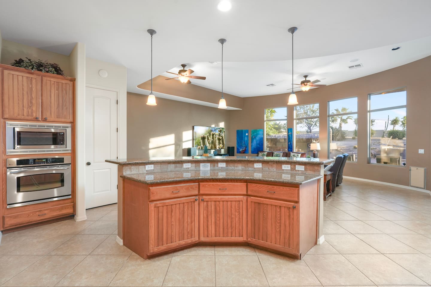 Large breakfast bar connecting the kitchen to the open living area.