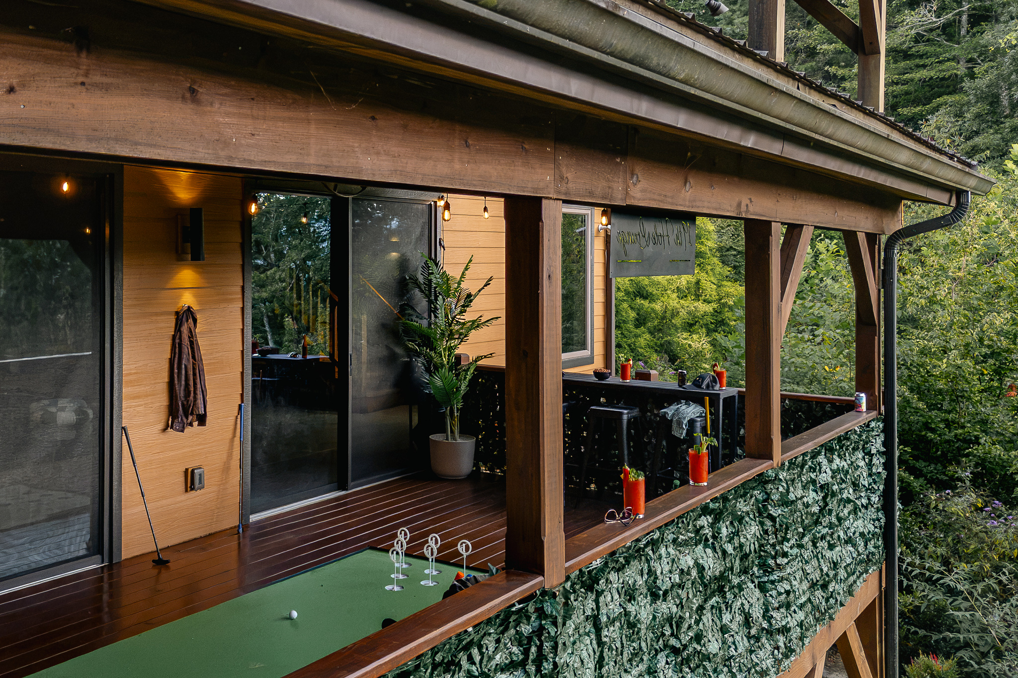 {19th Hole Deck} The covered mini-golf deck feels like its own little clubhouse, perched among the trees just off the main house.