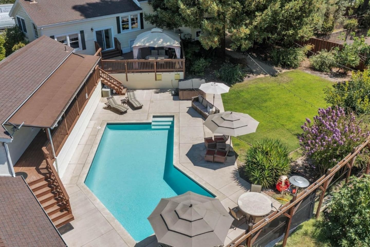 Backyard with pool, hot tub, and pool hosue bathroom.