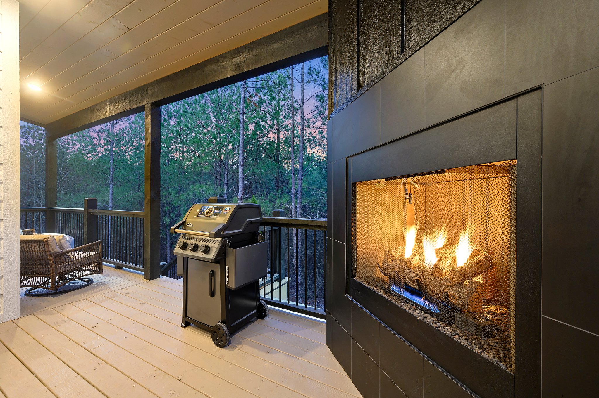 Evenings made easy—fireplace glow, private hot tub, and peaceful woods.
