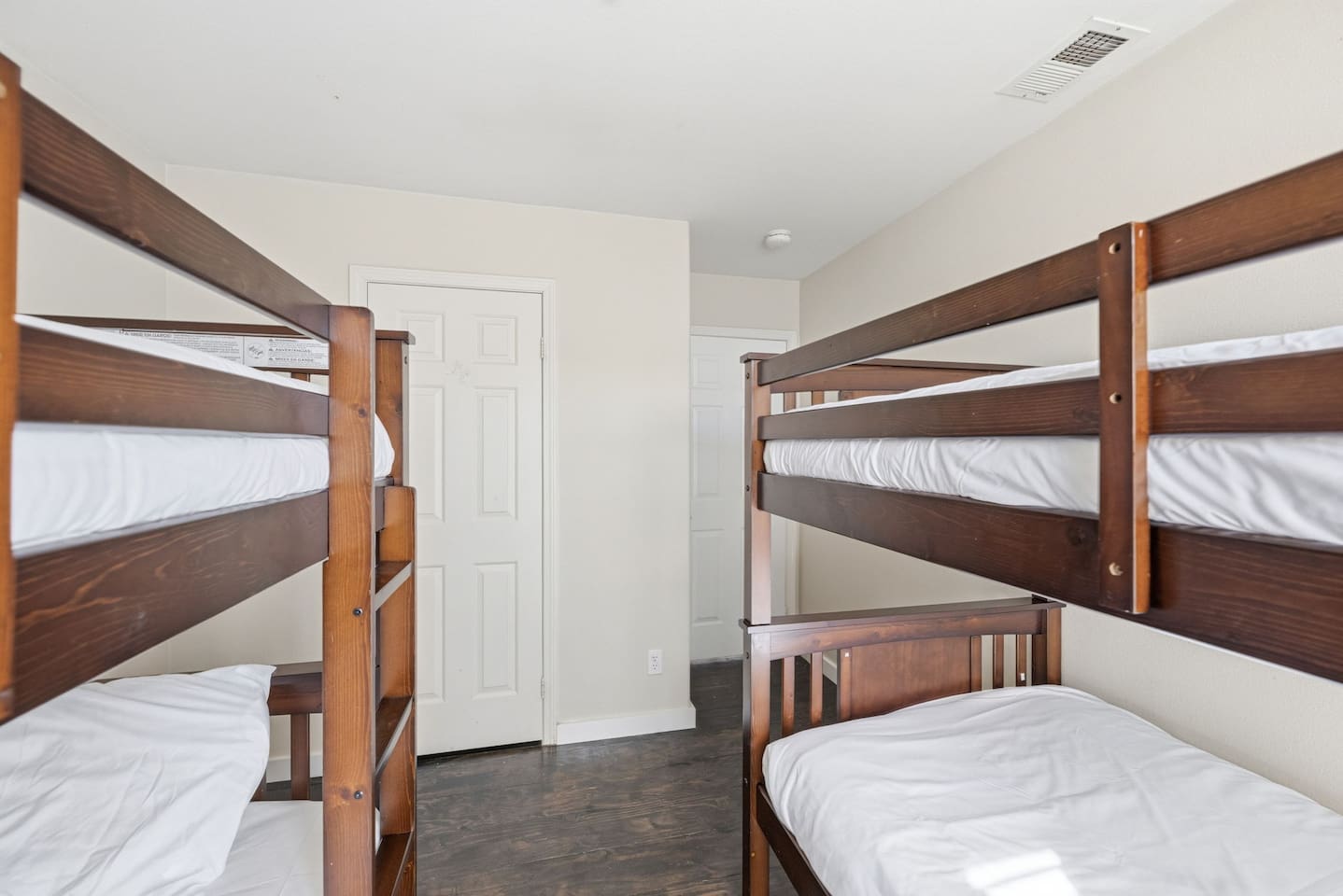 Twin bunk beds with clothing storage and room-darkening shades. Sleeps 4 — perfect for families needing flexible group sleeping arrangements.