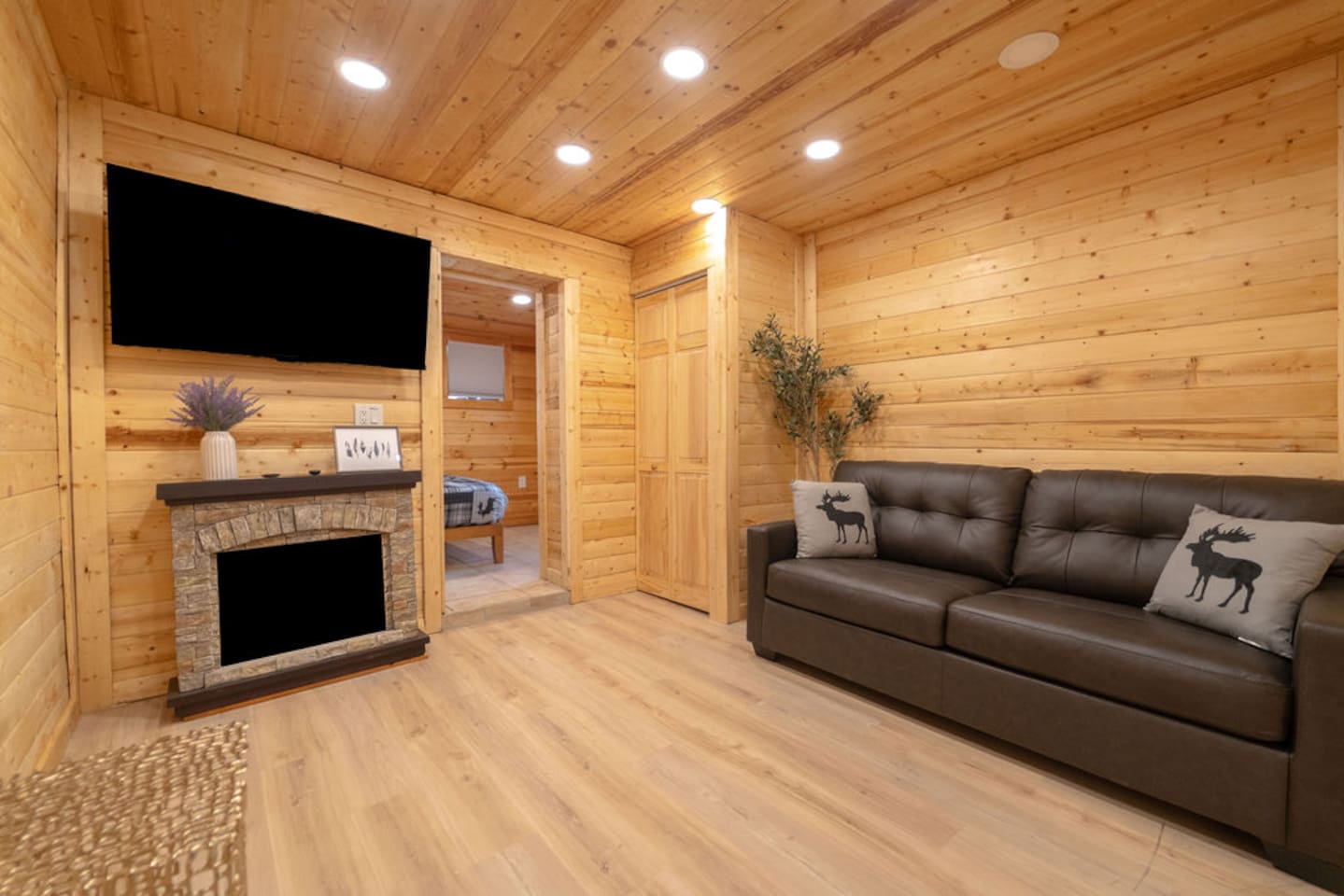 Snuggle up in this charming living room, featuring a sleek full-size leather sleeper sofa, a warm electric fireplace, and a 55-inch TV—the perfect retreat to unwind and relax after a day of adventure!