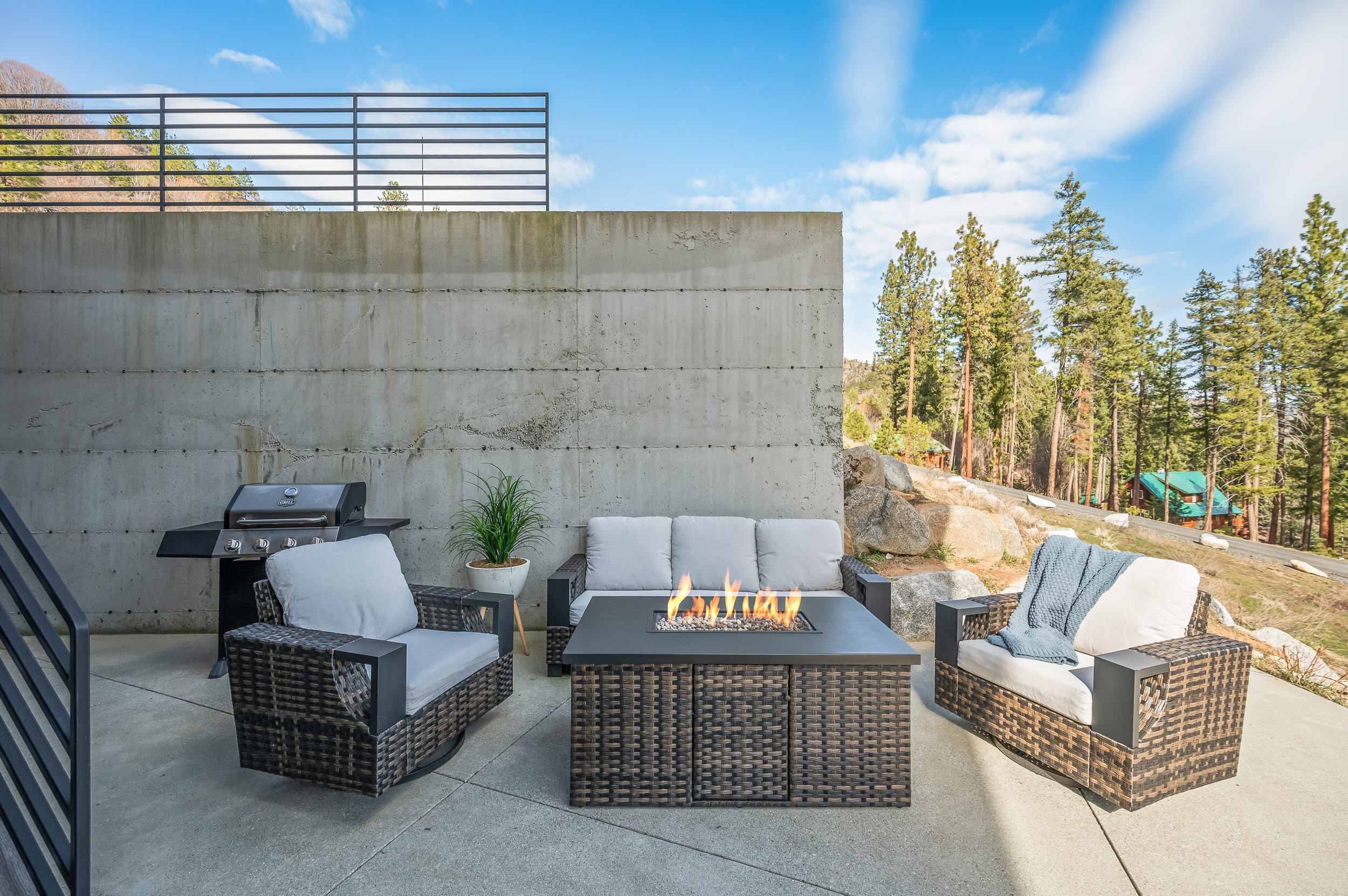 Outdoor lounge seating with fire table, rocking chairs, BBQ grill (propane provided)