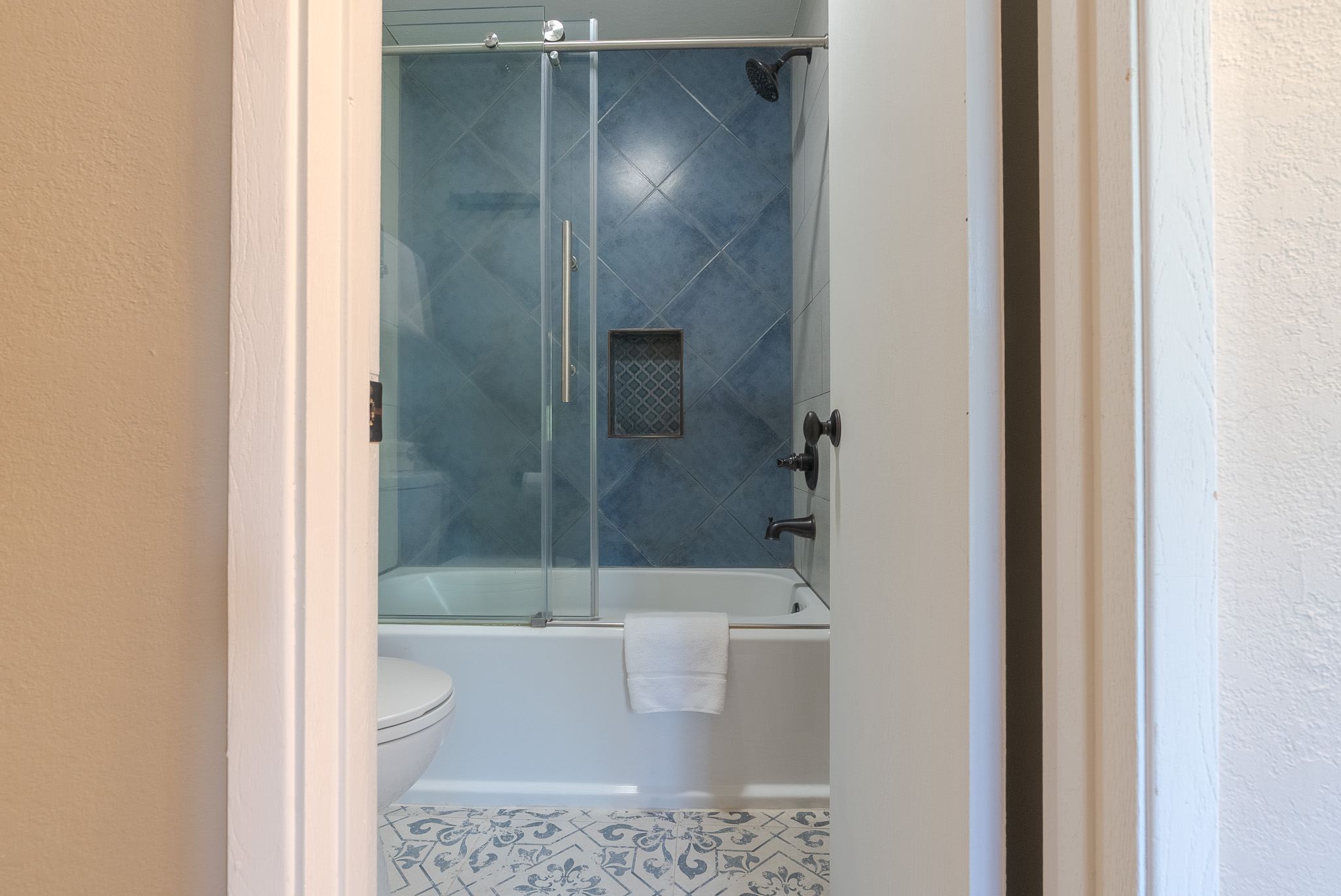 The only bathtub in the condo is in the ensuite bathroom.
