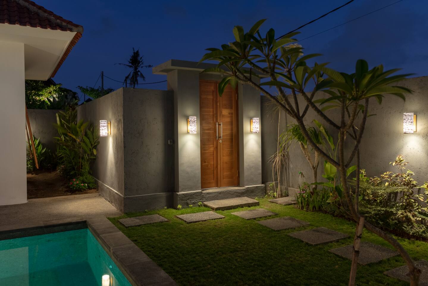 The entrance door to the villa at night