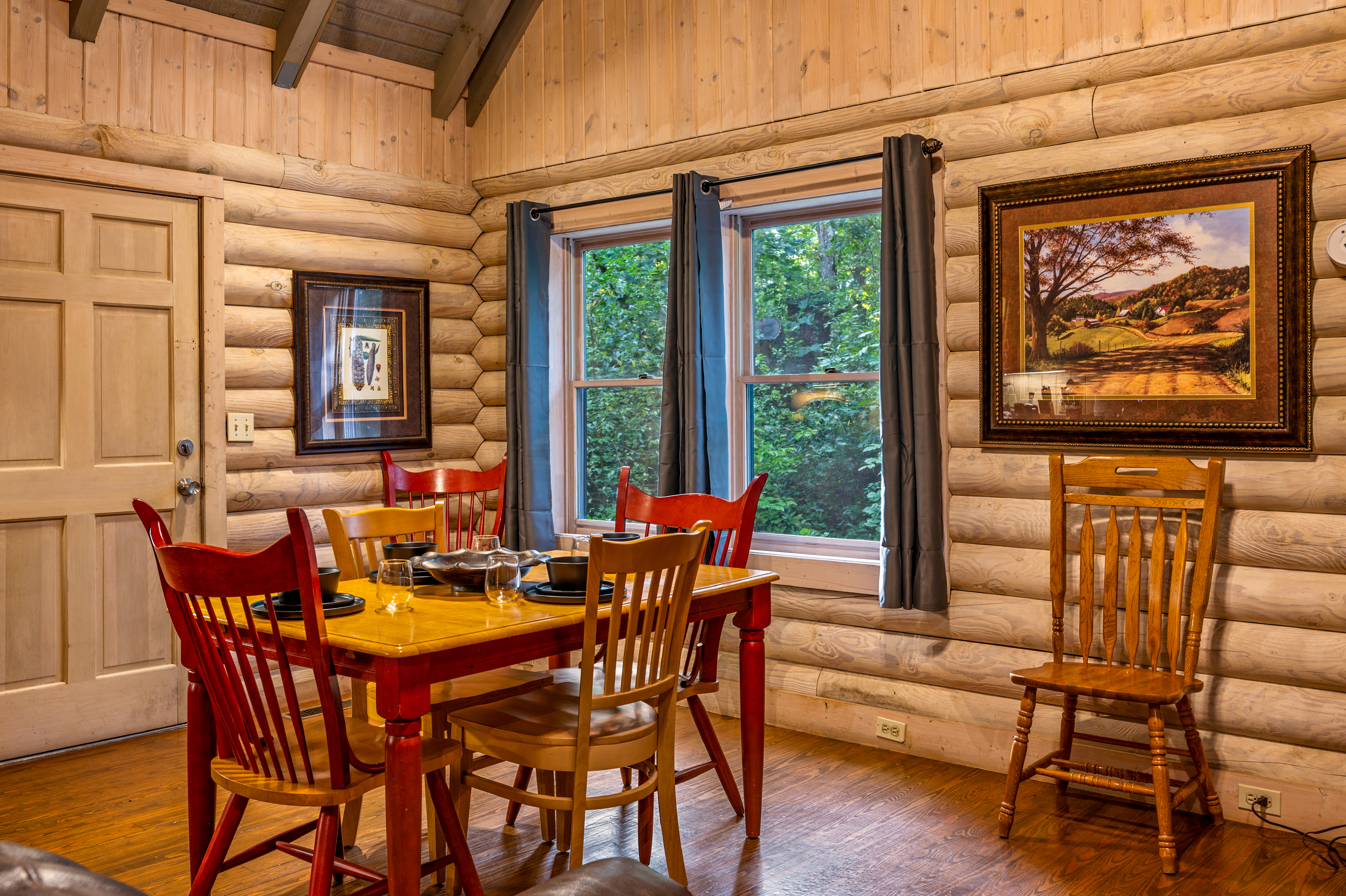 Your dining area, surrounded by log cabin charm and nature.