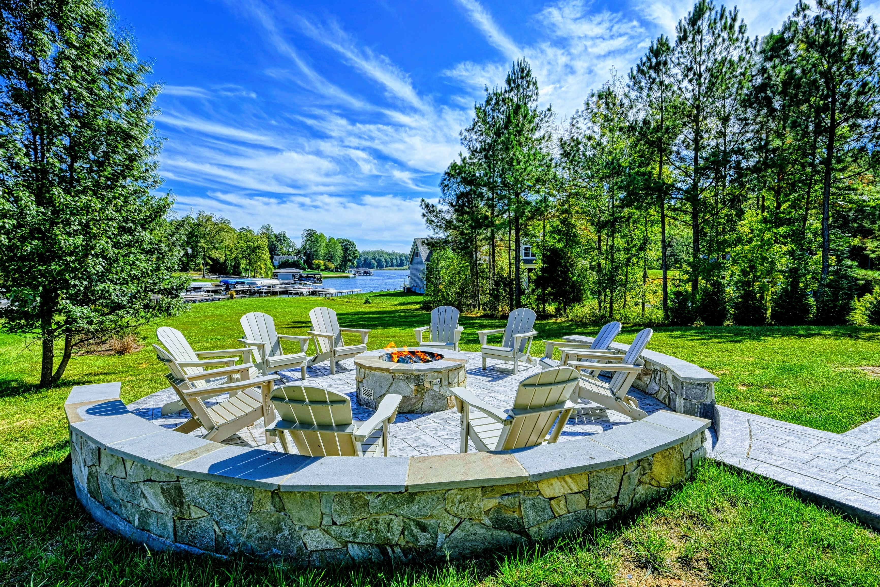 Enjoy serene lake views from the fire pit, surrounded by Adirondack chairs. Perfect for roasting marshmallows, sharing stories, or relaxing after a day on the water.