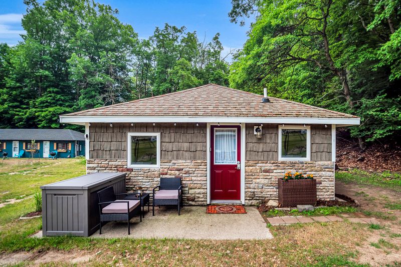 Step into The Duet Cottage and make the most of summer with cozy comfort, beautiful views, and laid-back lake living.