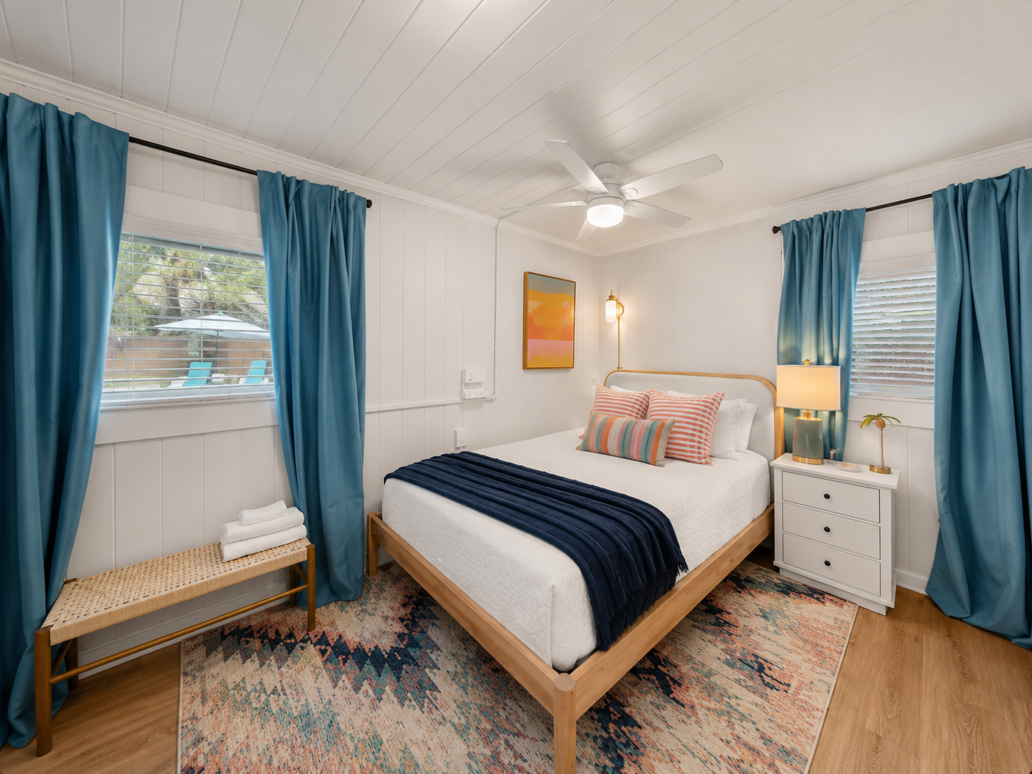 The back bedroom has a Queen bed and direct access to the pool. Enjoy privacy in the back of the house while streaming Netflix and go for a night time dip! 