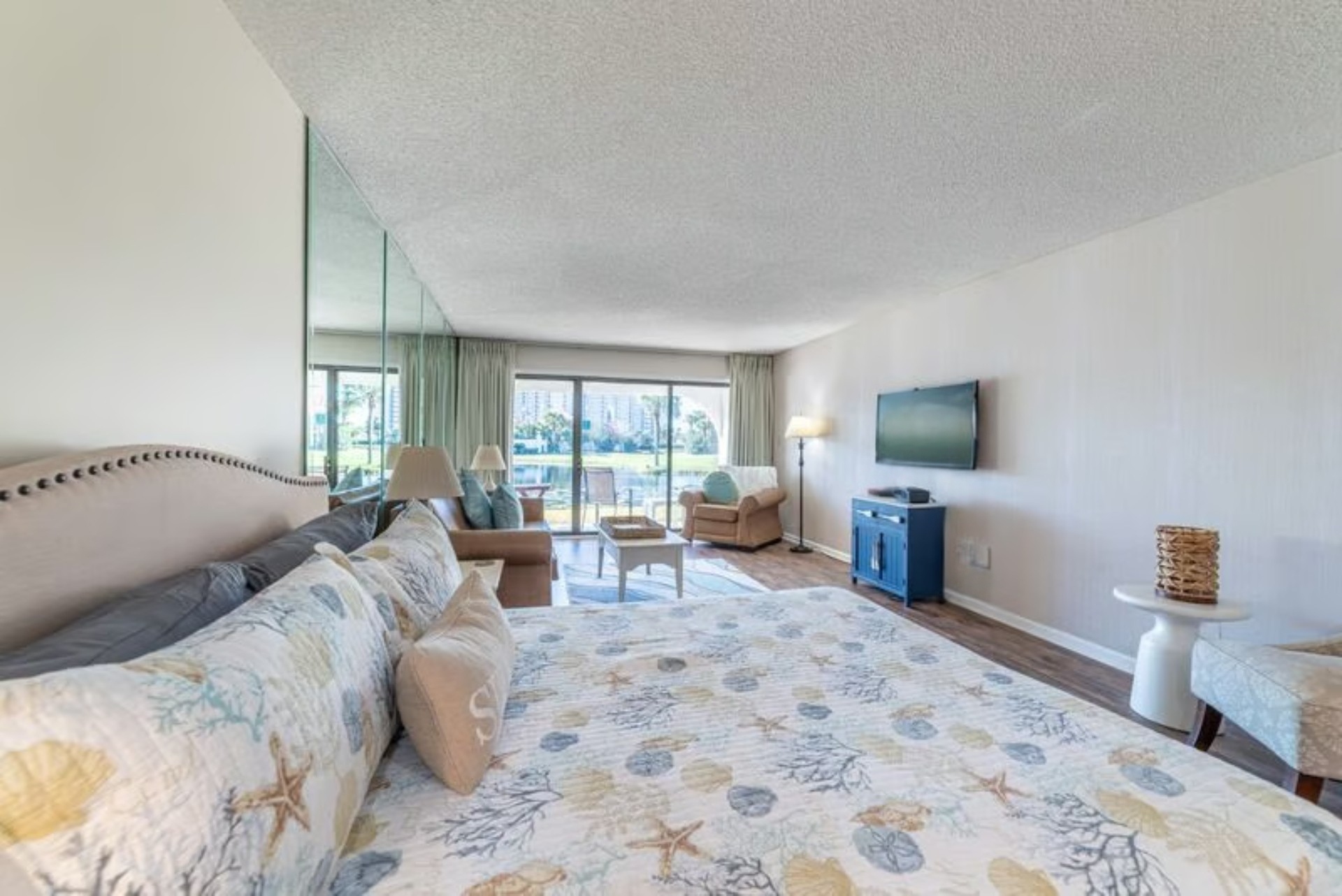 Queen bed + living area and patio access