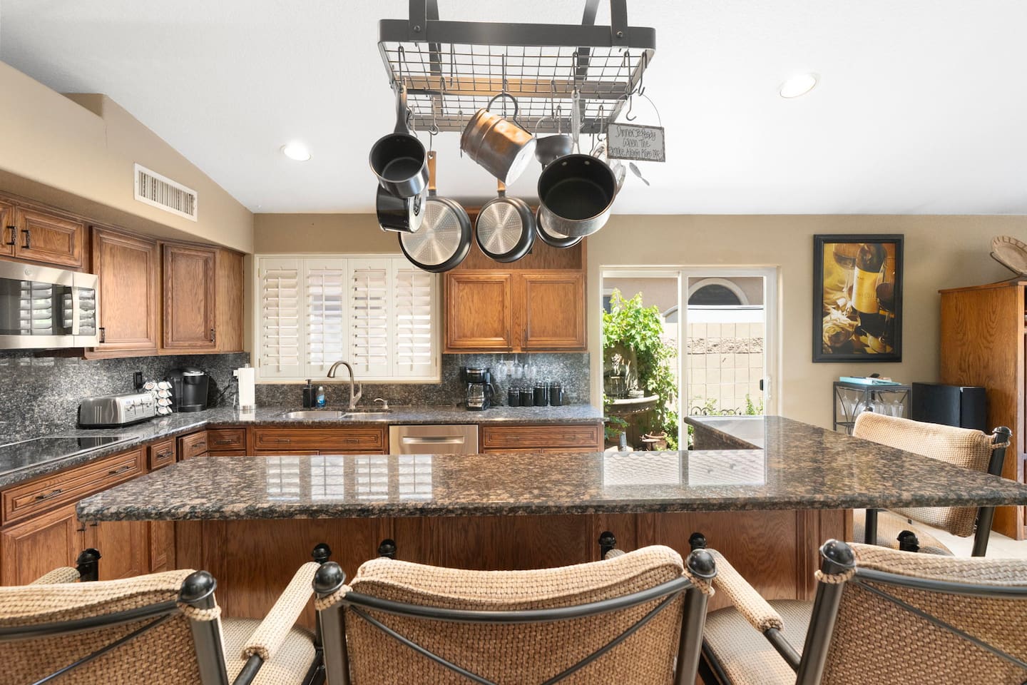 Pull up a seat at the granite island and enjoy casual dining or morning coffee while the chef gets to work — a perfect social hub for the group.