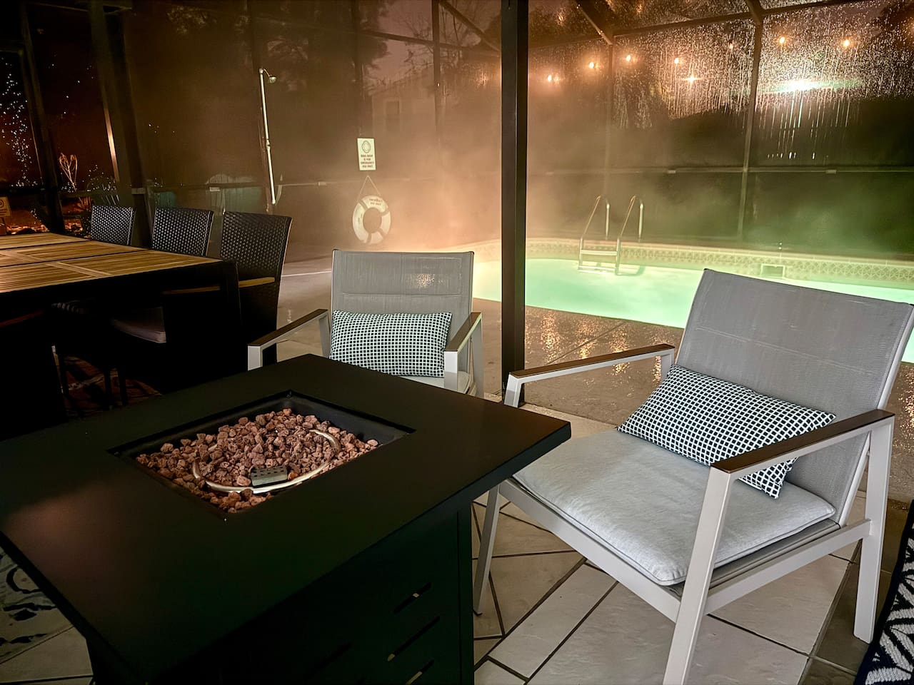 Fire table and warm pool water will keep you wanting to sit outdoors for hours.  Featuring lots of covered space under lanai. #outdoorVibes #SpringHillAirbnb #OutdoorOasis #UniqueStay #instaworthy 
