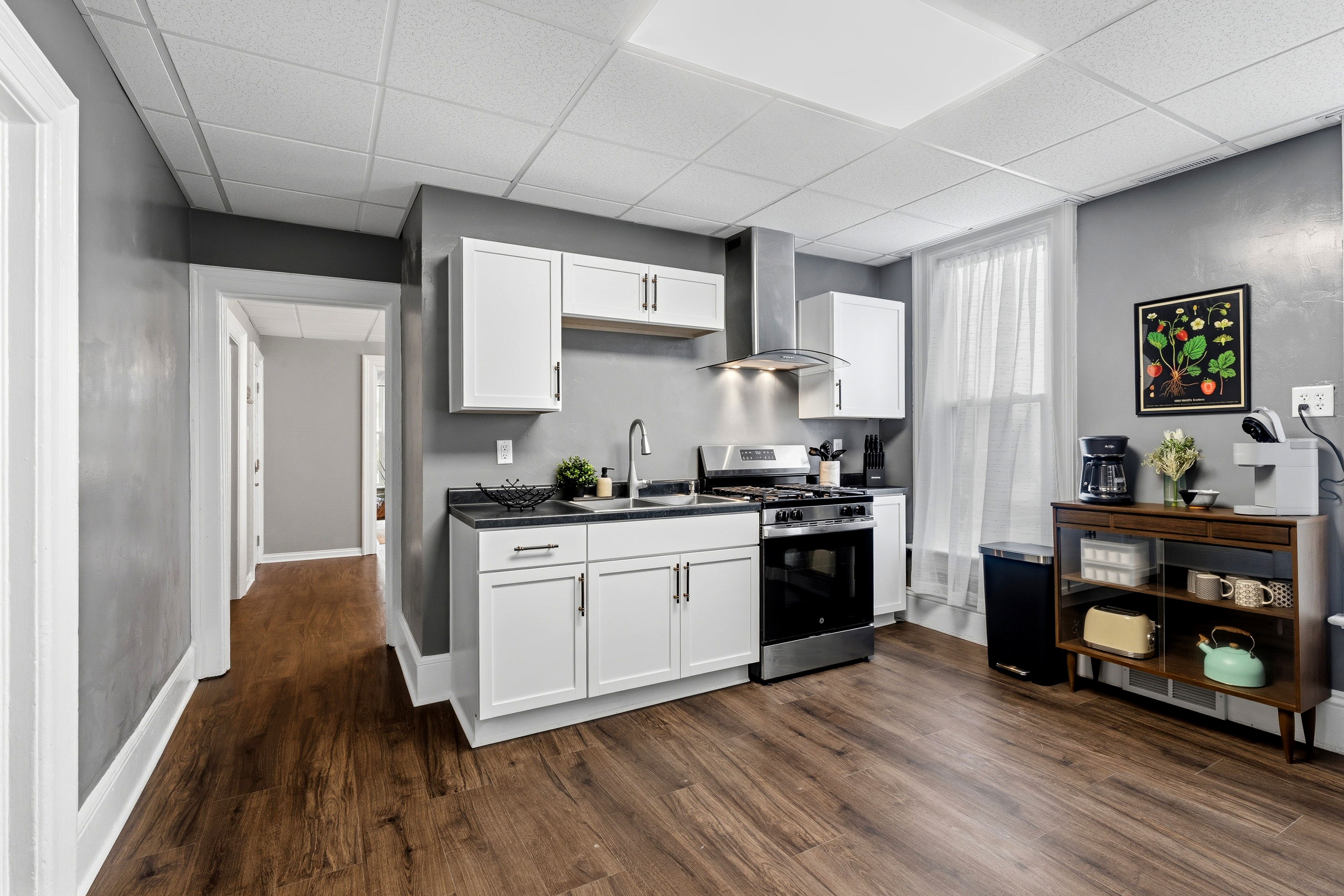 Gas range, vented range hood, and deep sink - perfect for cooking a your favorite meal