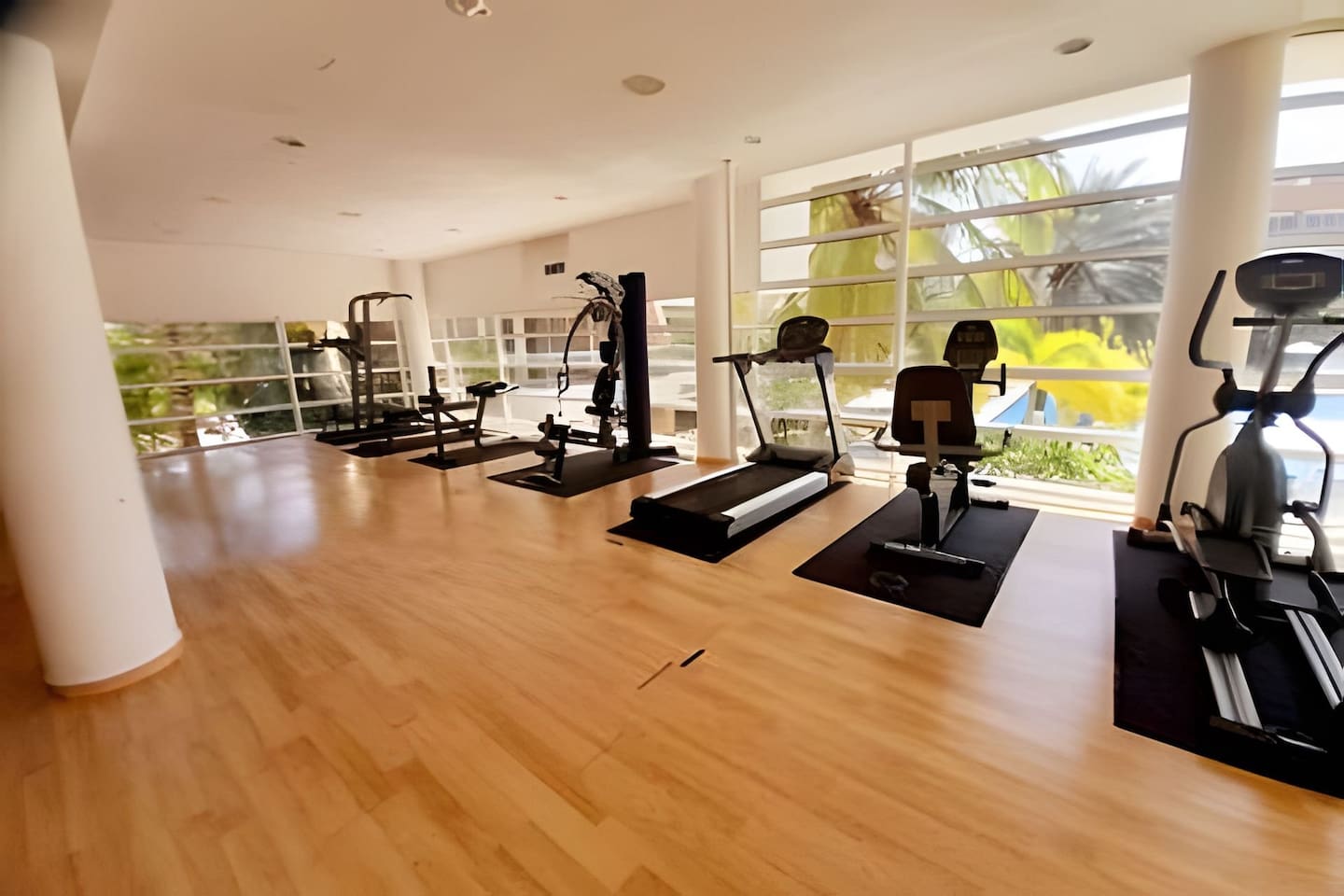 Cardio and strength training options with a view of the outdoors.