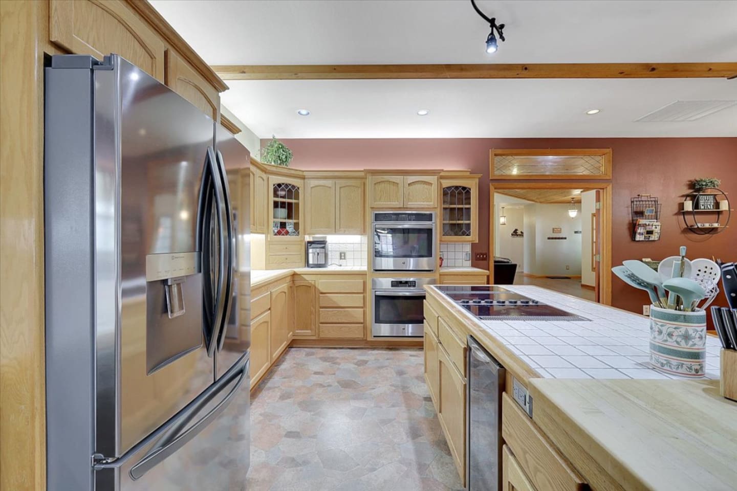 Kitchen with full appliances, plenty of counter space, and easy access to the dining area.
