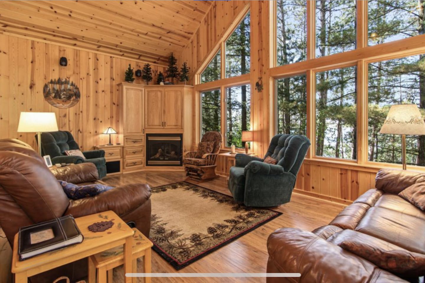 Main level living with fireplace. Tv is in the cabinet space above fireplace. 