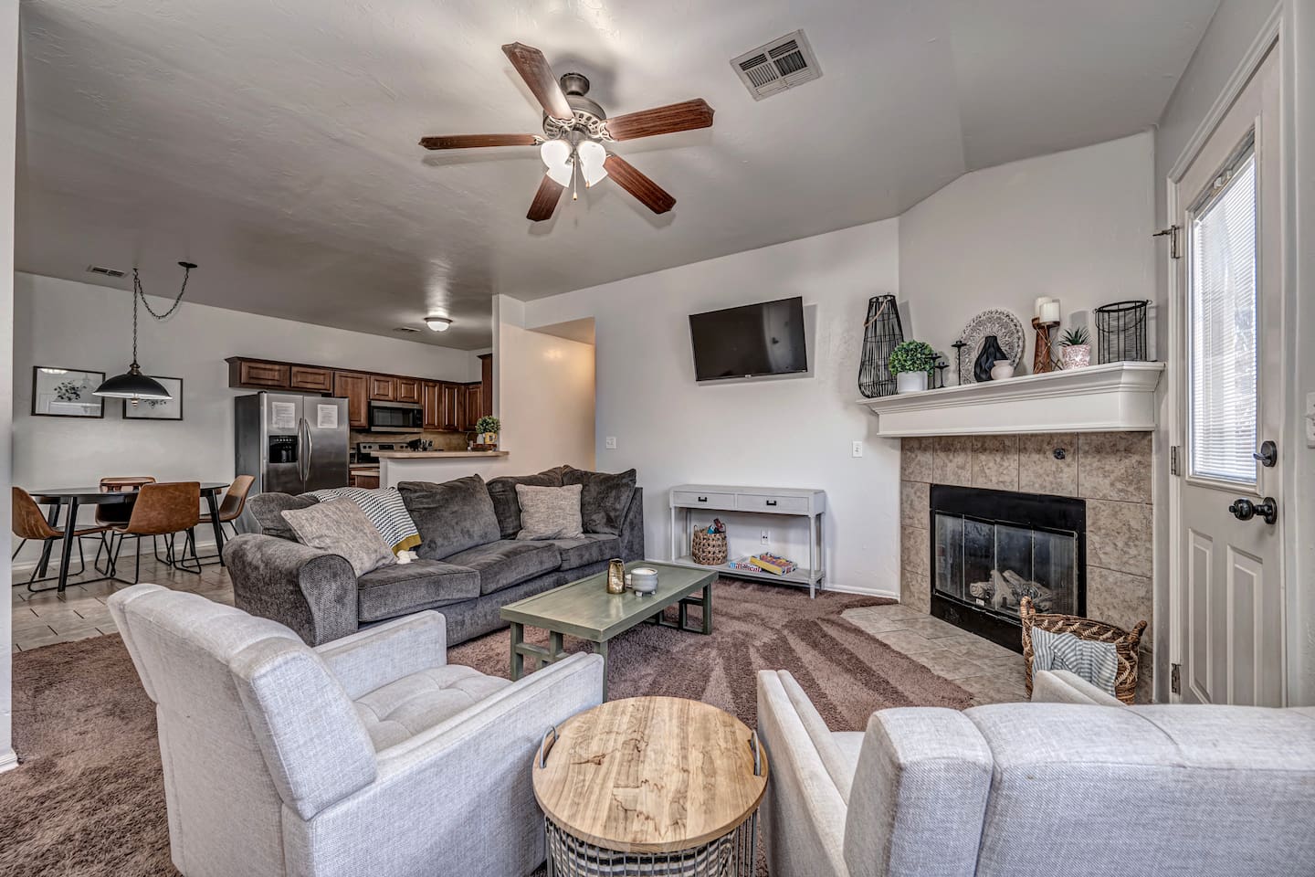 Inviting living room with smart TV, fireplace, and plenty of comfort.