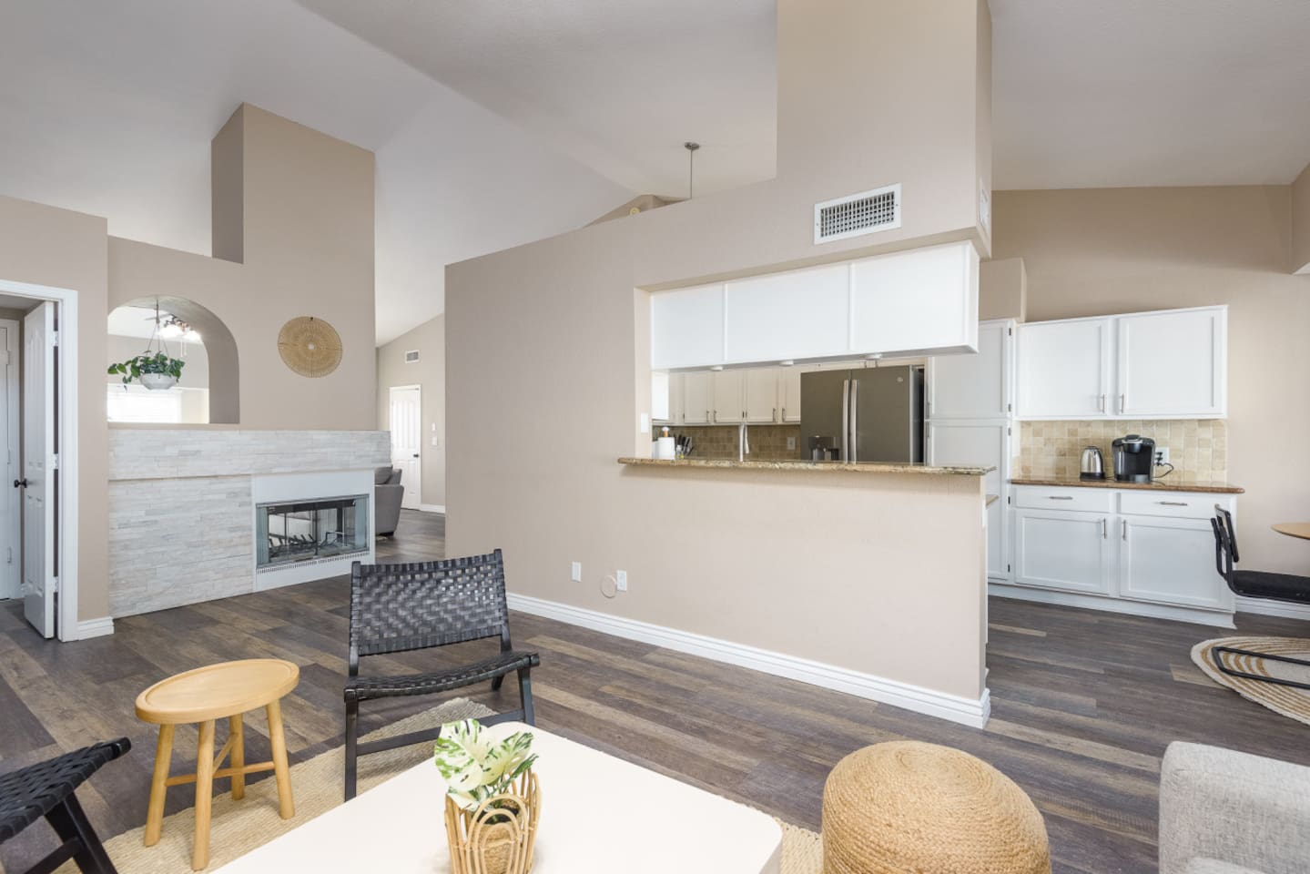 Living area with fireplace, TV, kitchen pass-through, and comfortable seating for relaxed indoor downtime.