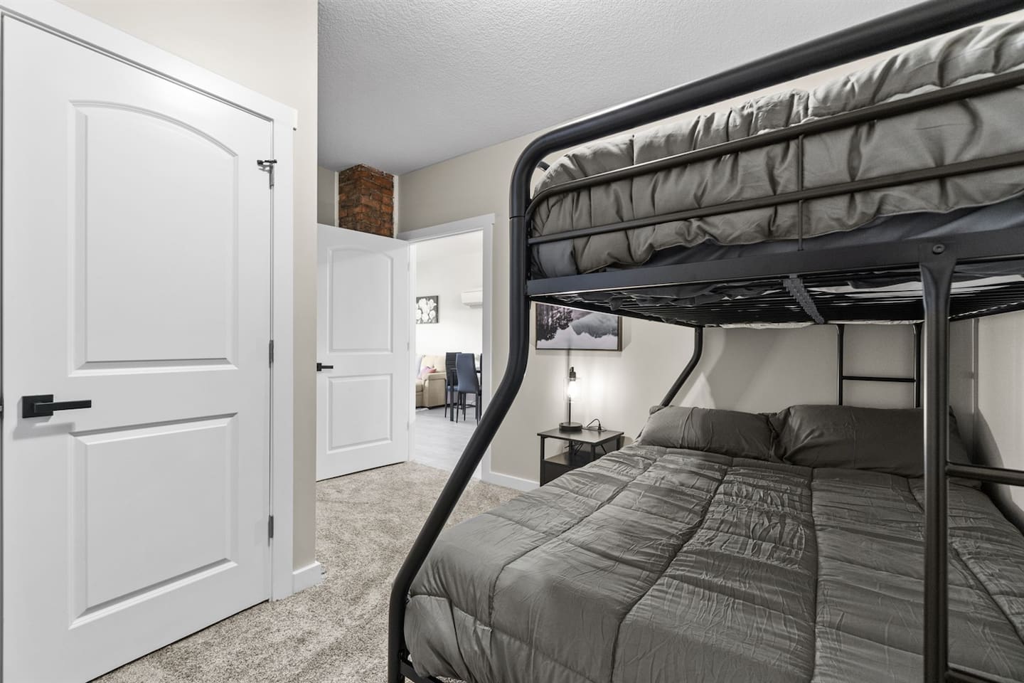 Comfortable bunk bed featuring a twin bed on top and a double bed below, ideal for both kids and adults.