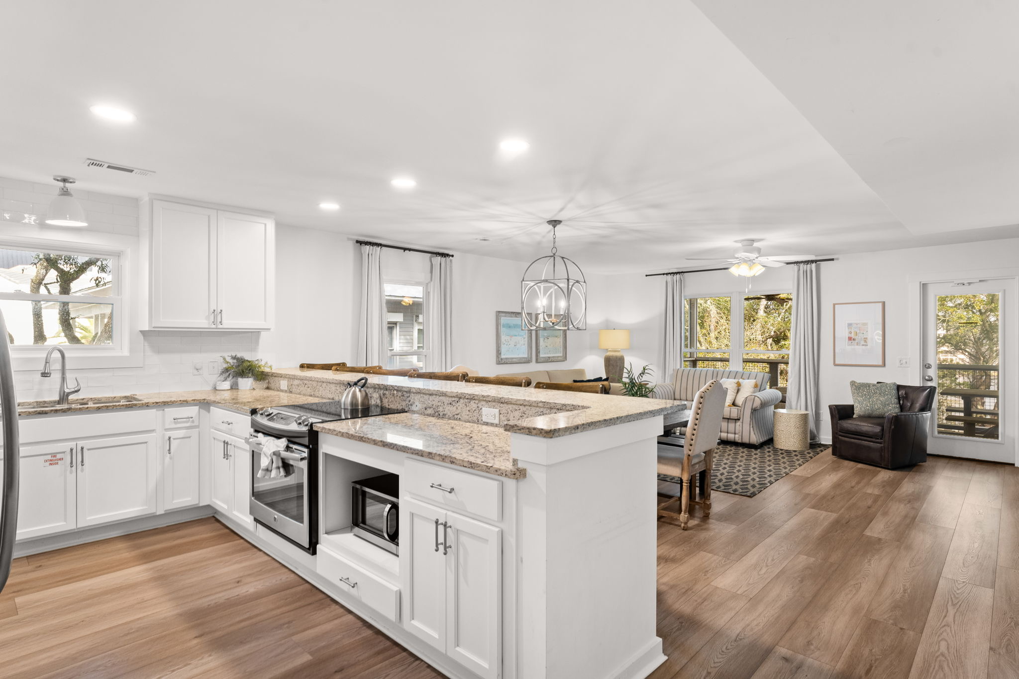 Side A, 2nd Floor: Choose between the indoor dining tables, casual barstool seating, or the lakeside screened-in porch.