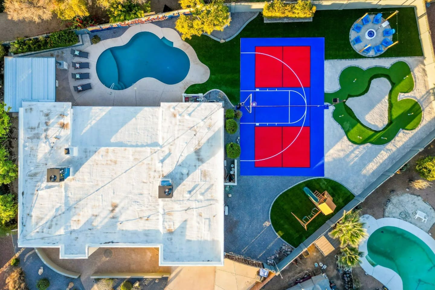 Pool on one side, sport court on the other, putting green in between — this layout was made for a group that wants options.