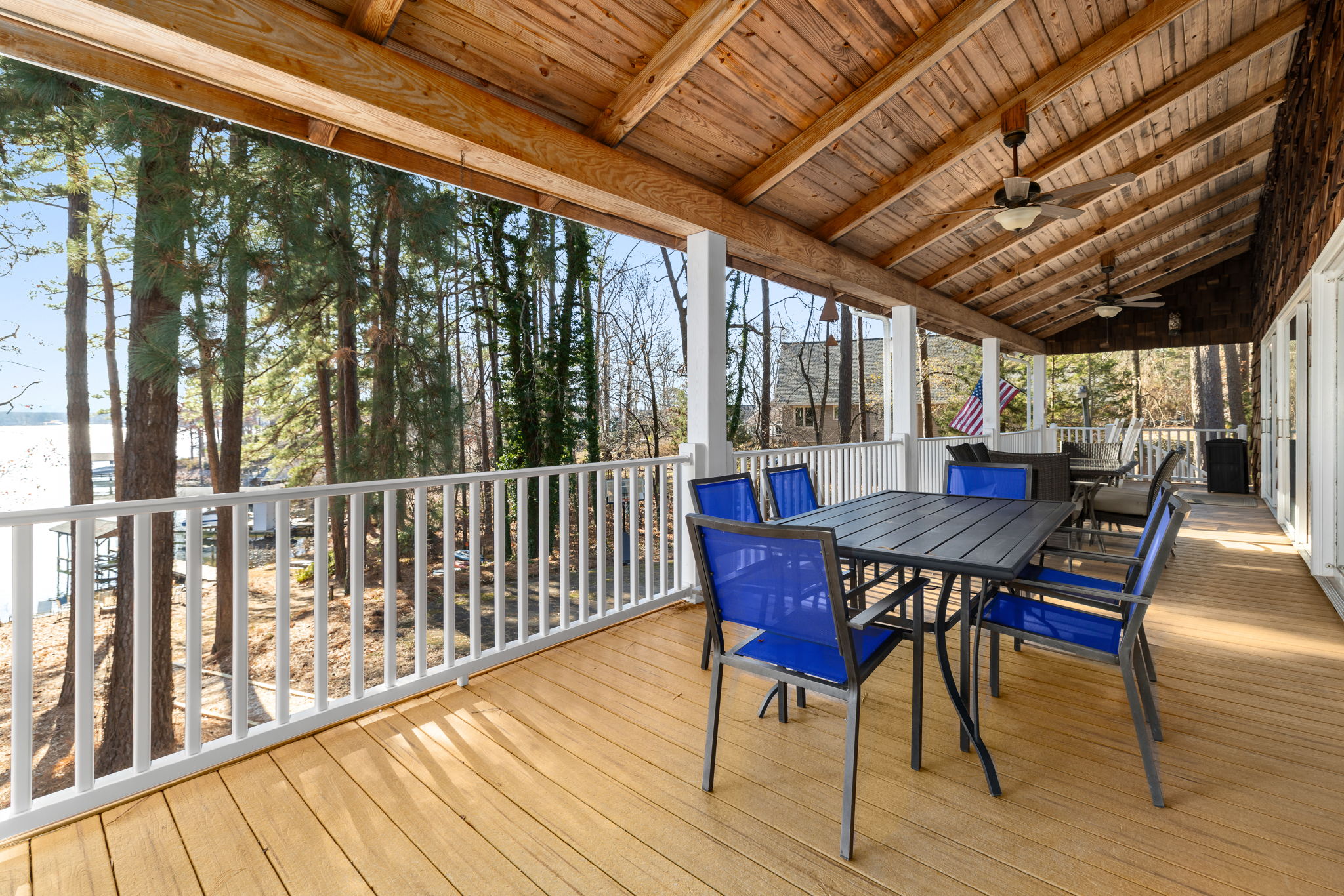 Porch with two 6-person tables and 3 rocking chairs!