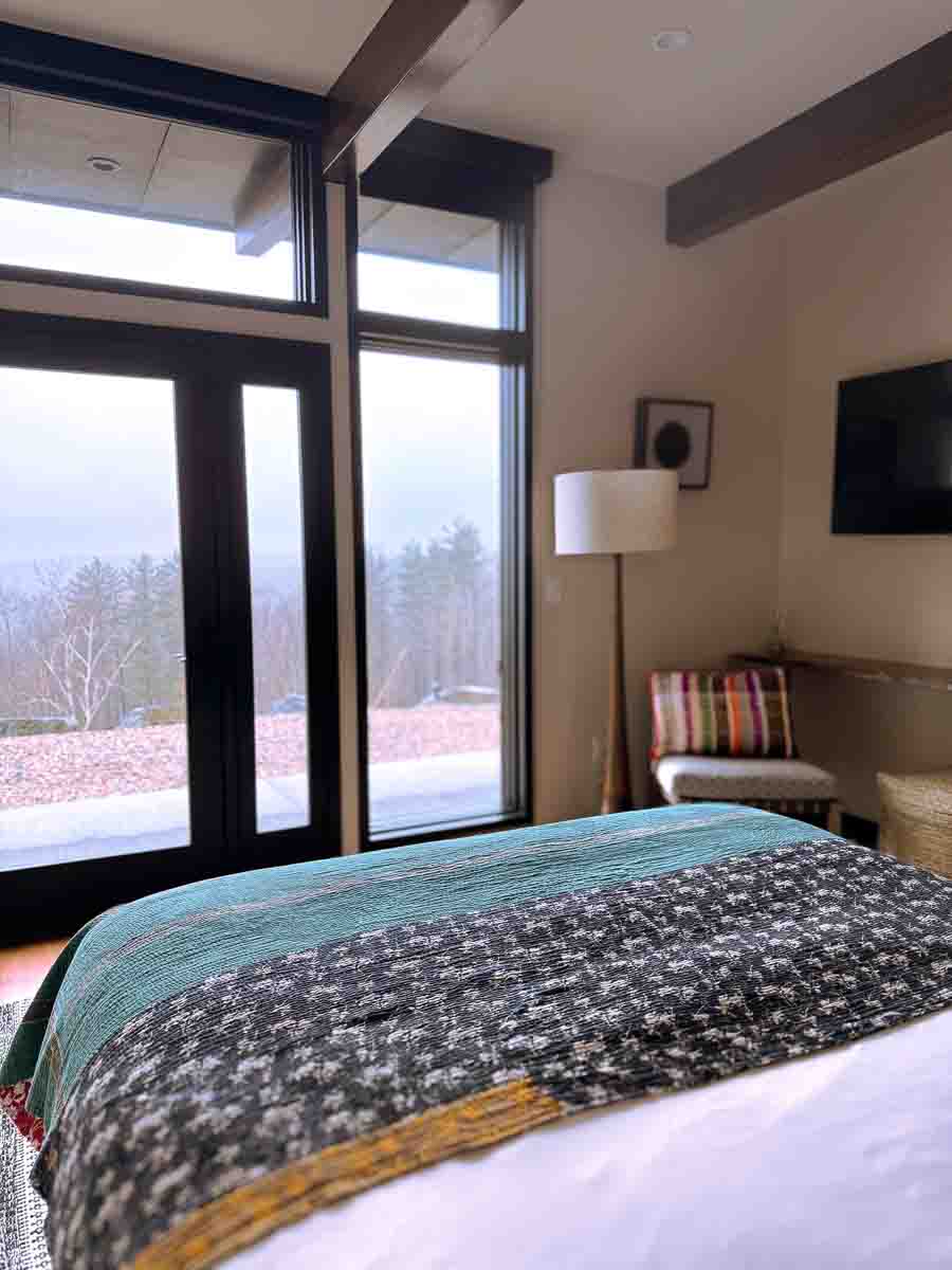 Bedroom Three at Sunset Falls &mdash; glass door to private stone terrace