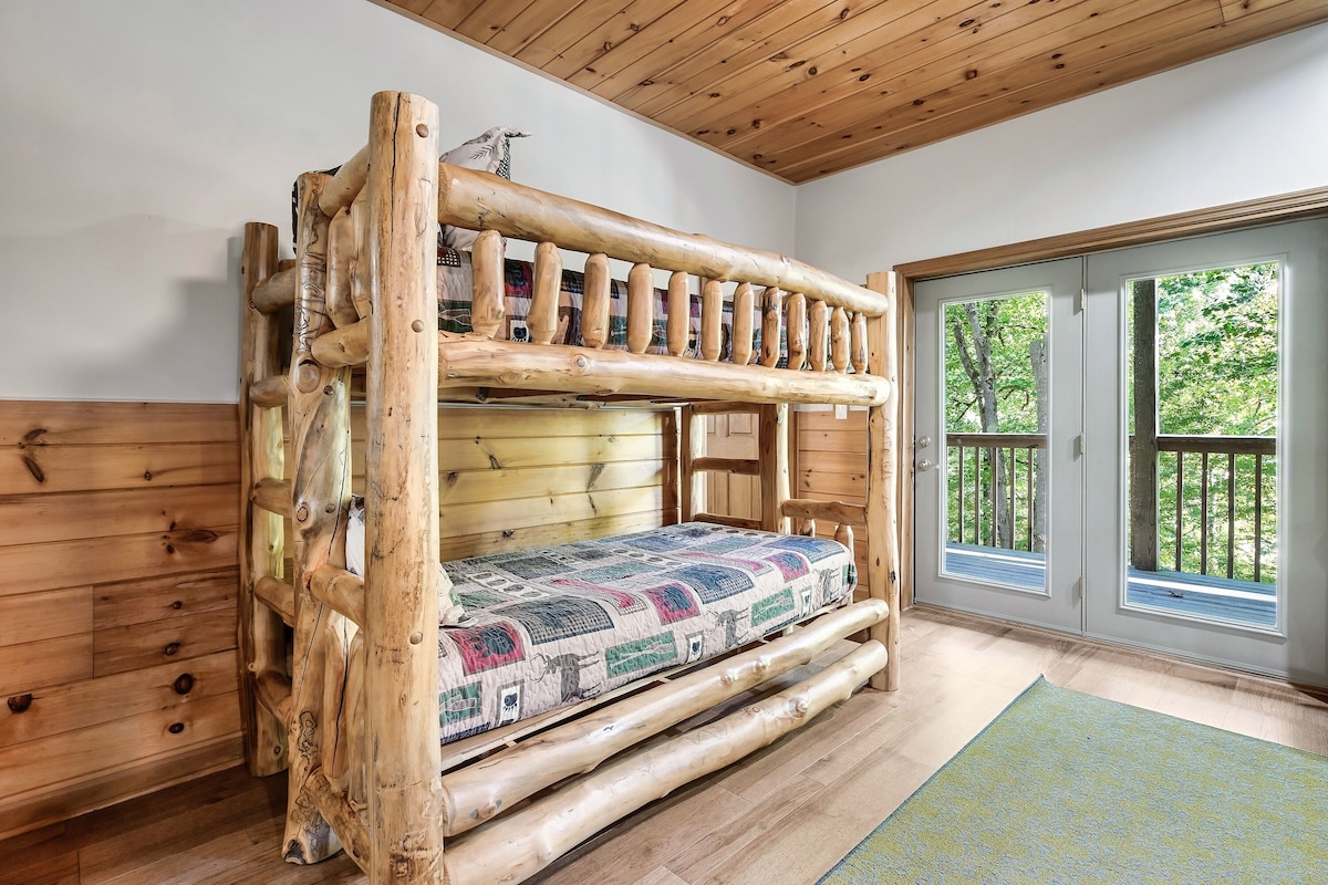 The game room has twin bunkbeds, billairds, 65" TV, NFL Blitz, a great couch for haning out, and a barrel arcade game with lots of retro games hiding in there!