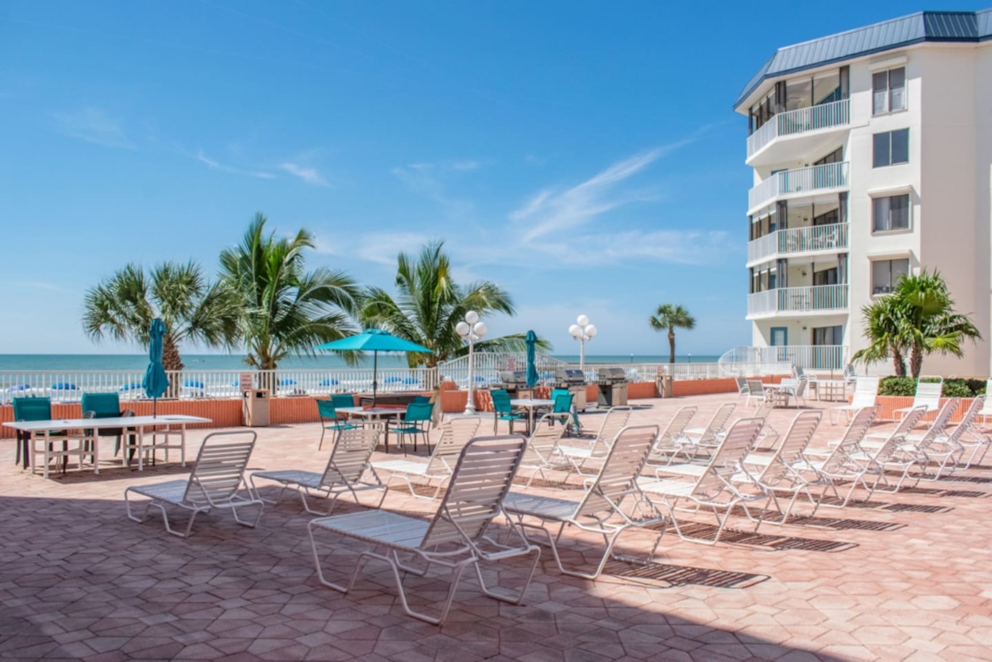 Heated Pool open year round with ample seating, overlooking Gulf of Mexico.