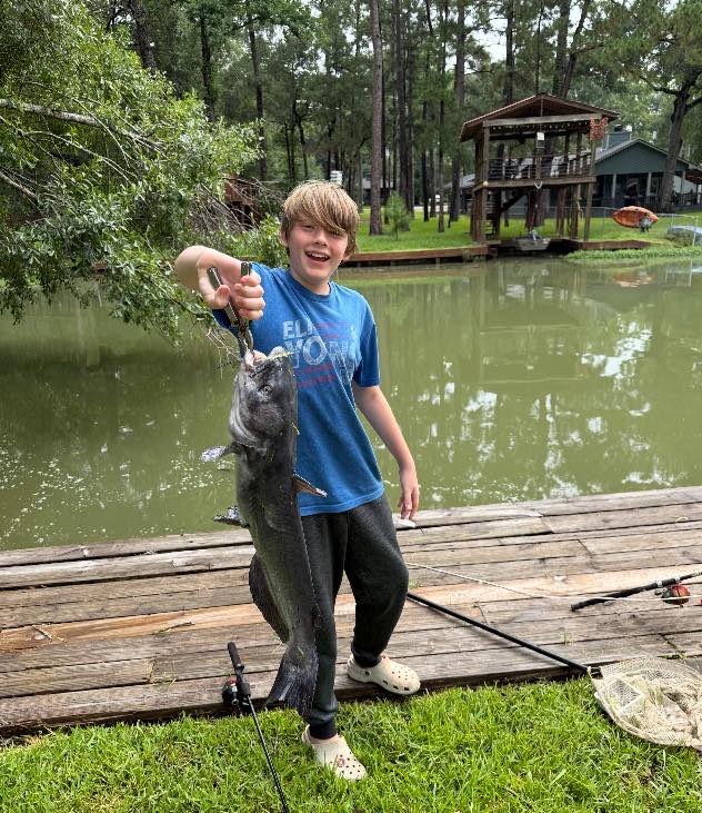 Catching a huge catfish on the backyard dock!