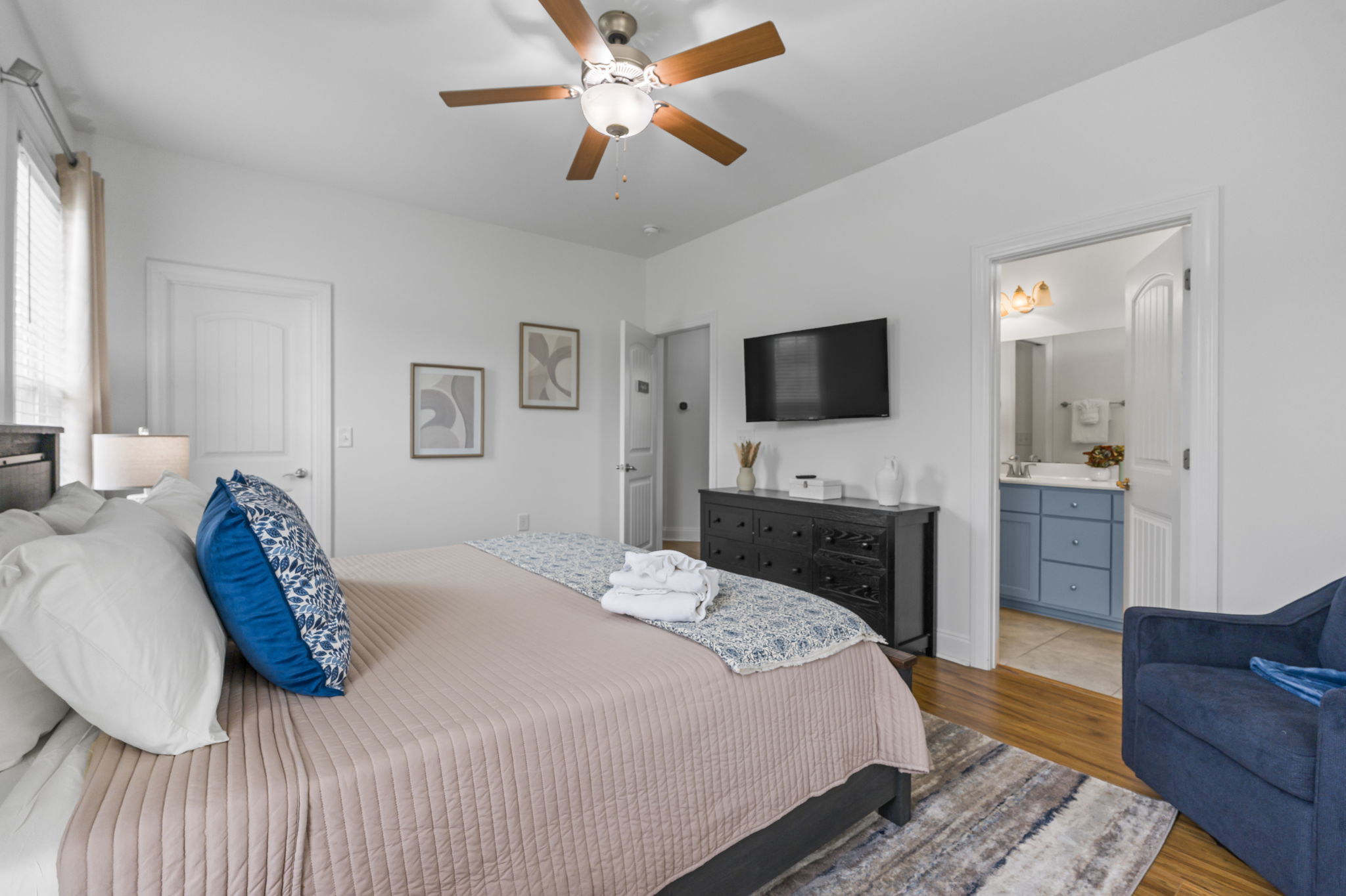 The Augusta Room - primary bedroom with king bed and ensuite bathroom
