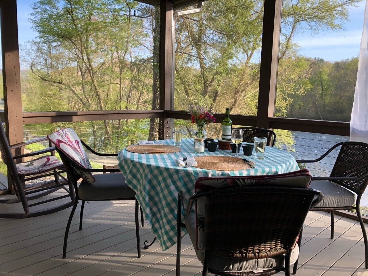 Screened in dining porch off the kitchen and living room. Dining at its best!