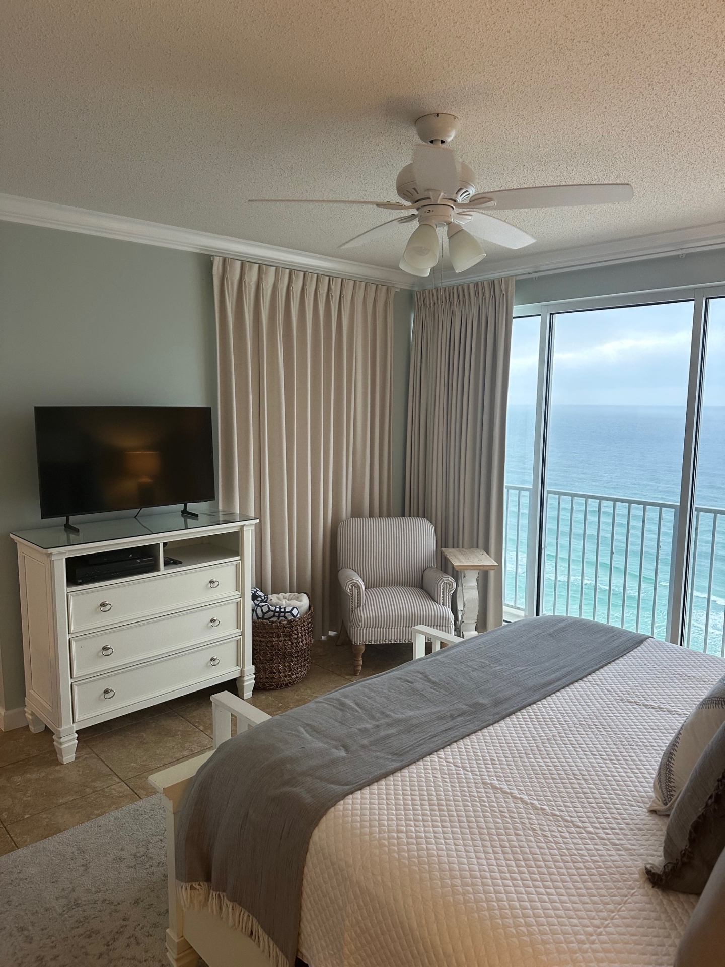 Master bedroom with king bed and beach view and smart TV