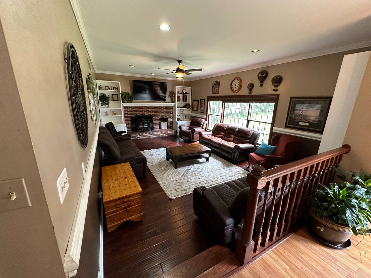 Relax on this large Family room  (16ft x 24ft) with 10 ft ceiling on the first floor. It has 3 full size sofas, and 2 single rocker recliners and 1 fixed chair. It has a large pellet stove in the fireplace for a winter backup to heat pump.